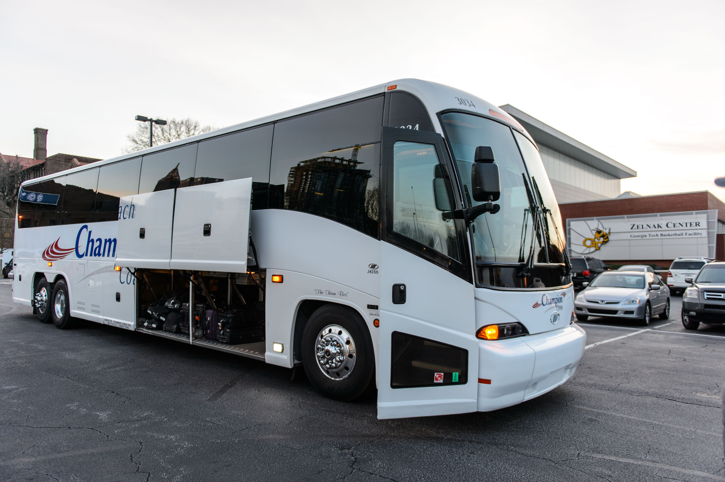 After eating, the team loads the bus and departs for the airport.