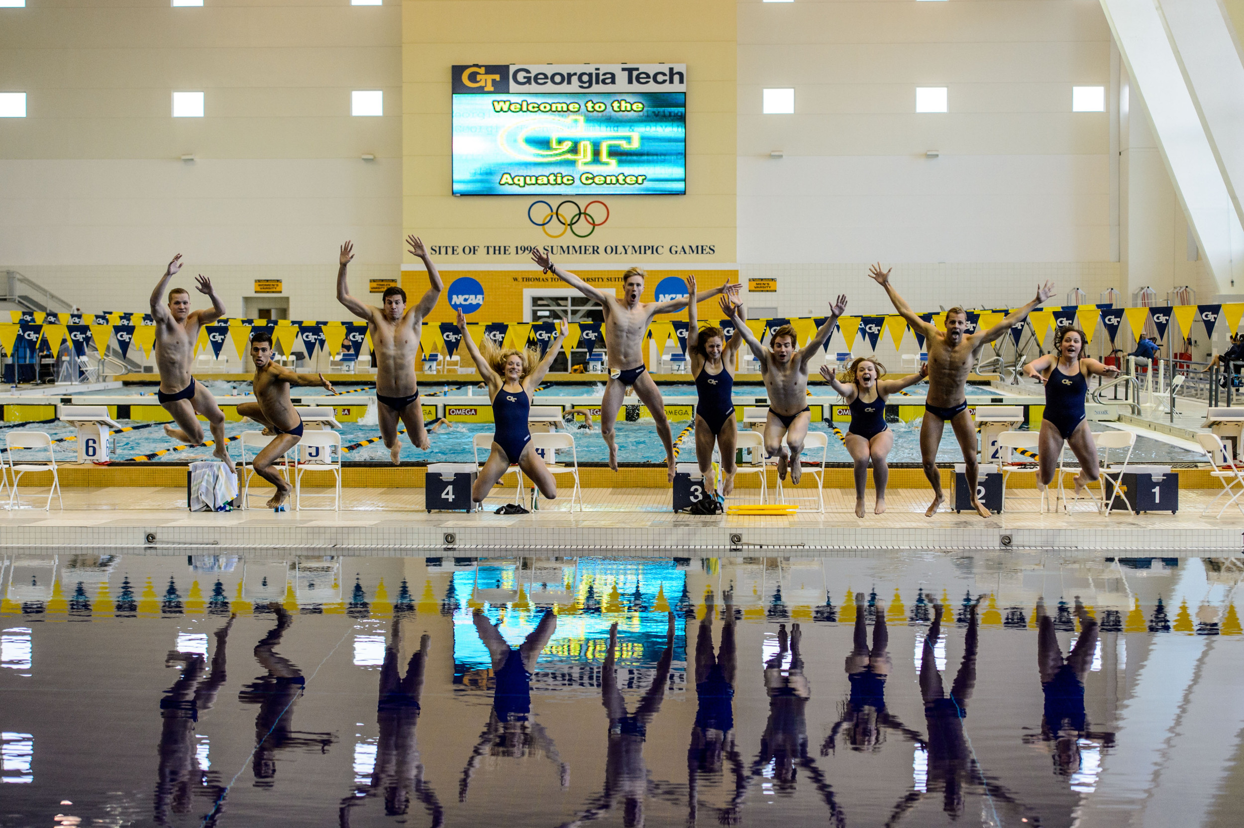 Seniors Kate Brandus, Elliott Brockelbank, Andrew Chetcuti, Dylan Kase, Andrew Kosic, Kelsey Maloney, Catherine Richards, Mark Sarman, Nico van Duijn, and Kate Woolbright leap into the pool at the end of the meet