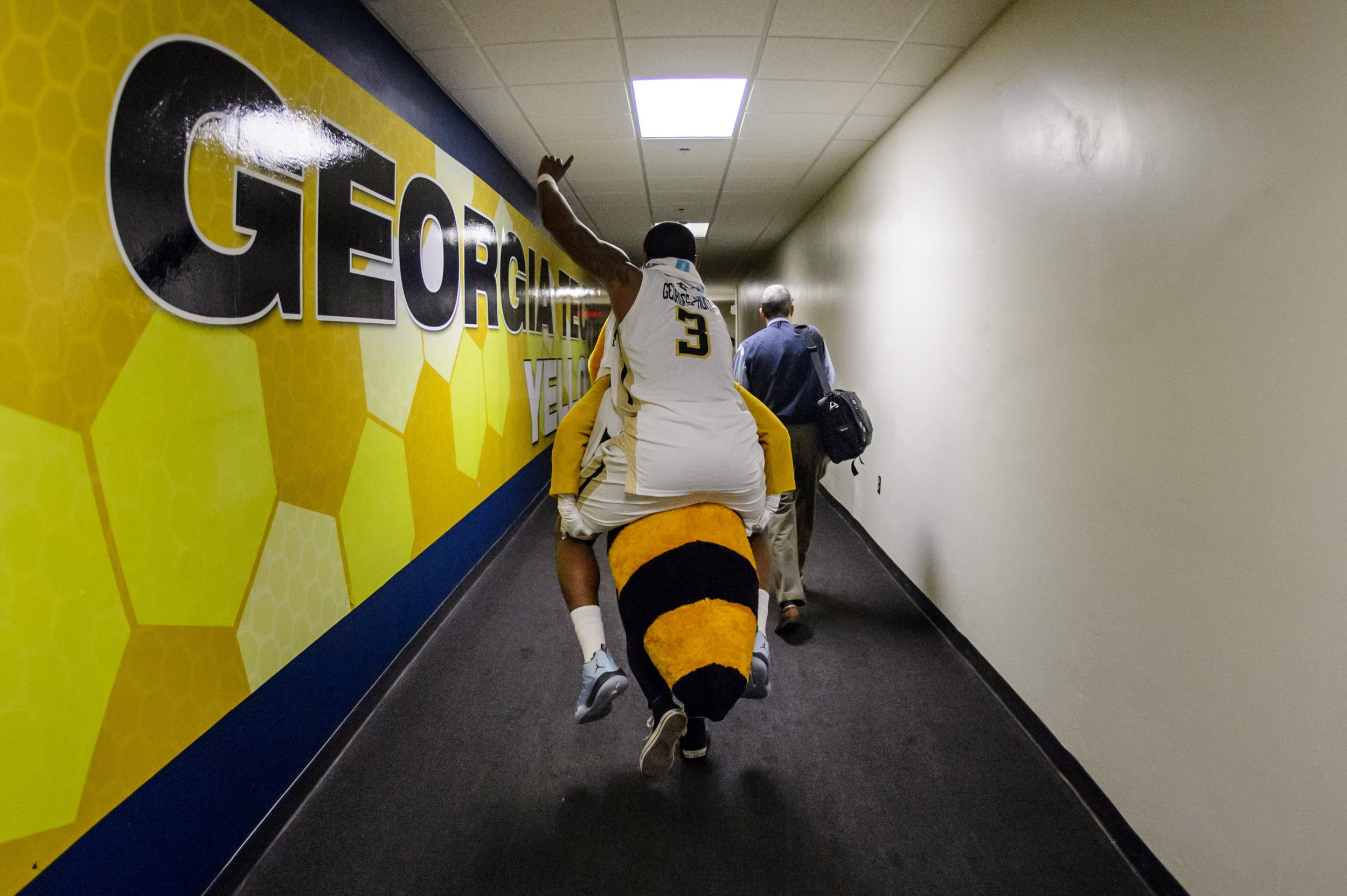Buzz gives Marcus Georges-Hunt (3) one final ride out of McCamish Pavilion