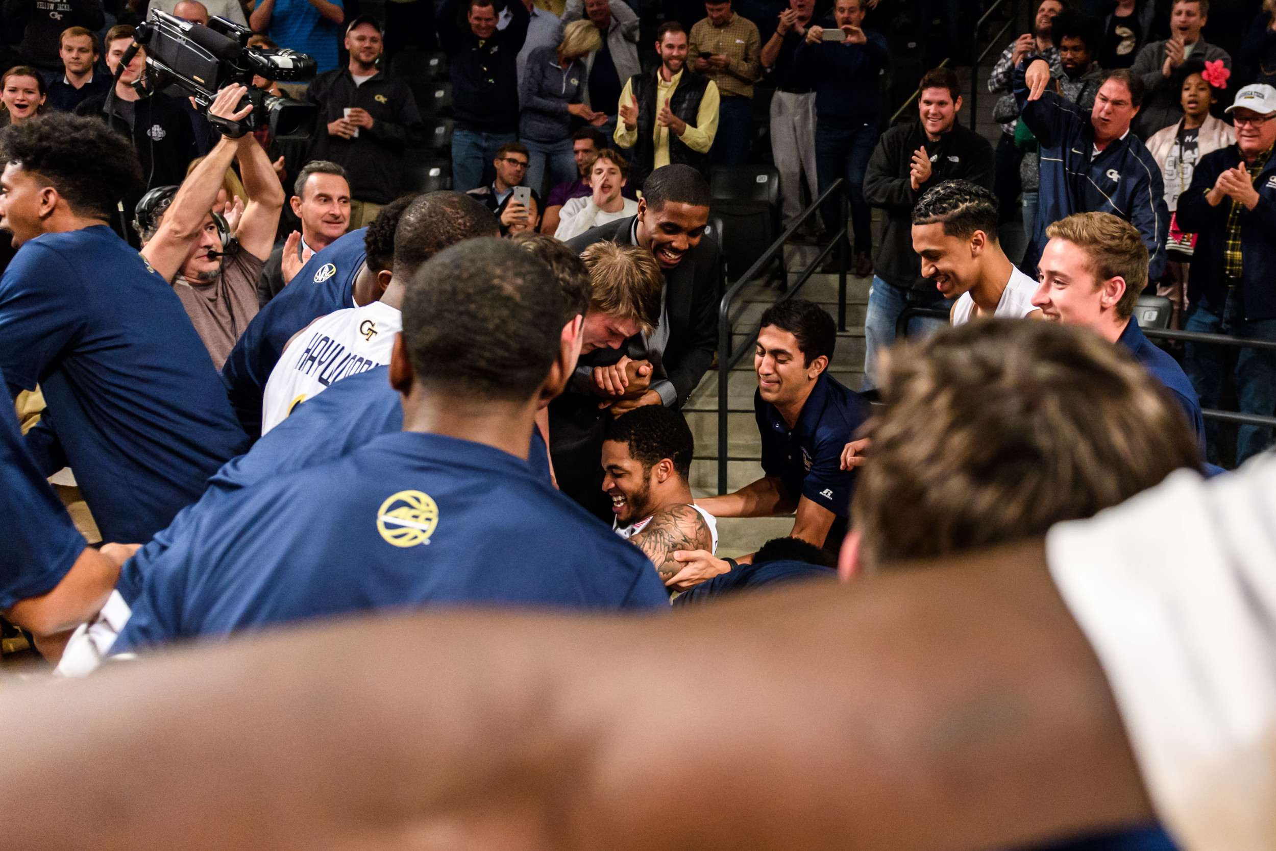The Jackets swarm Tadric Jackson after the buzzer beater