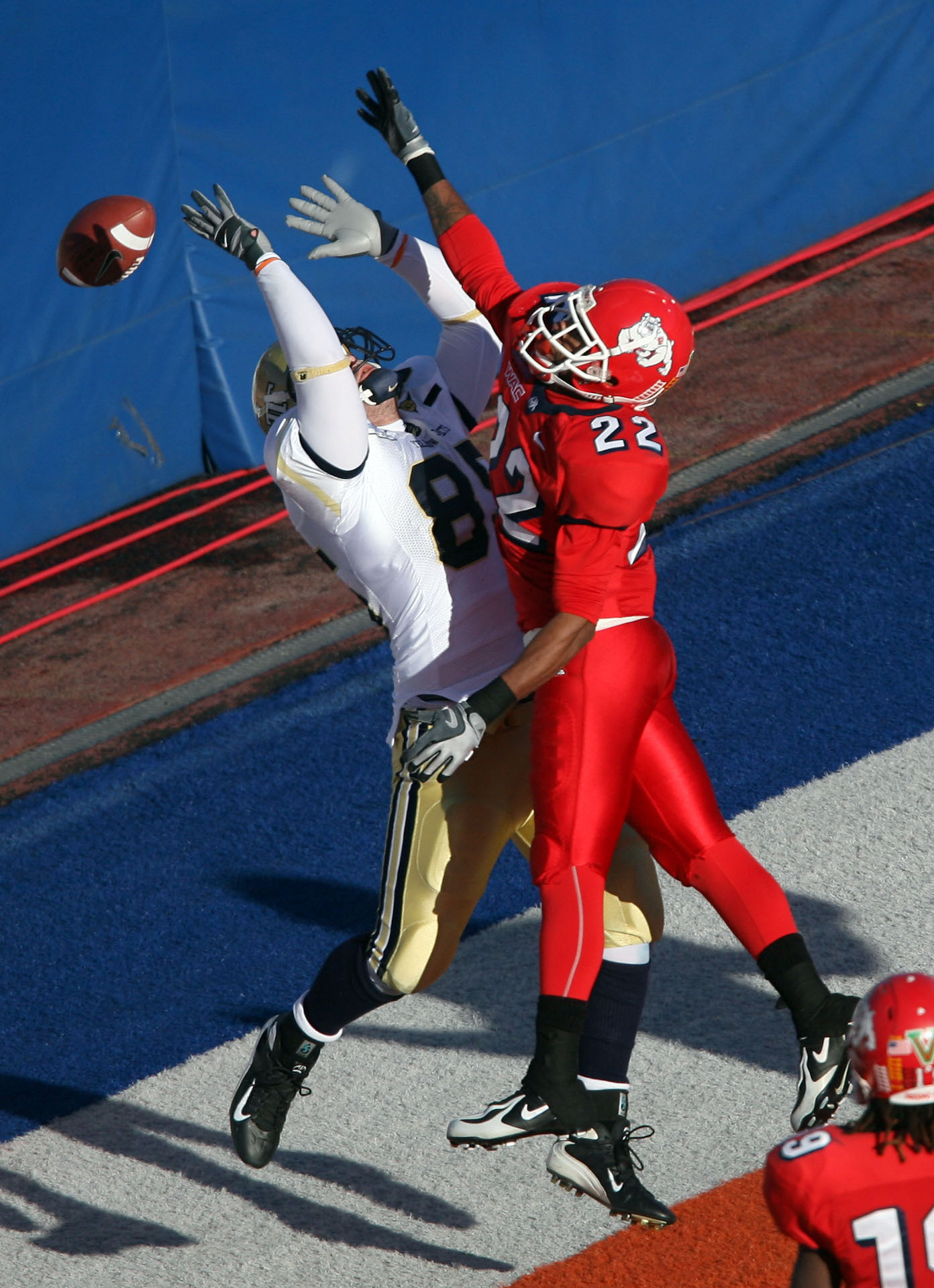 Georgia Tech tight end Austin Barrick can't come down with a pass under pressure from Fresno State cornerback Damon Jenkins in the second half.