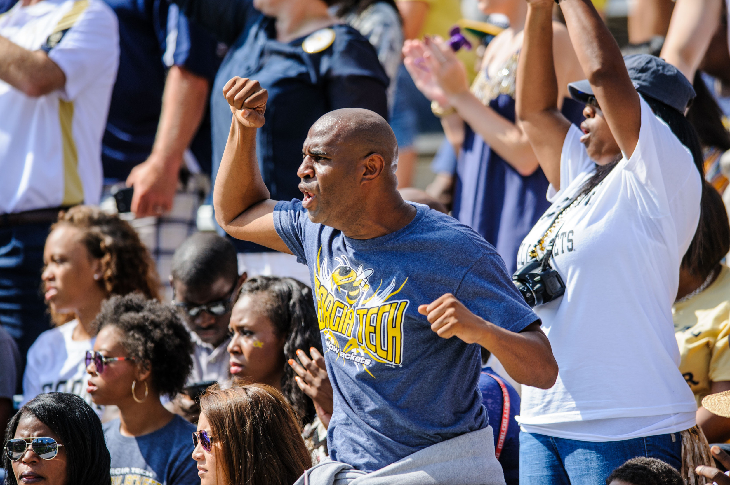 A Yellow Jackets fan cheers the team on