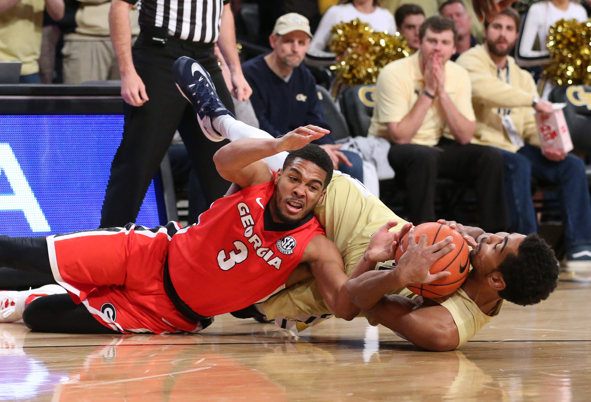 Georgia Bulldogs guard Juwan Parker (3) and Georgia Tech Yellow Jackets forward Quinton Stephens (12) fights for a loose ball in the first half of their game at McCamish Pavilion. Jason Getz-USA TODAY Sports