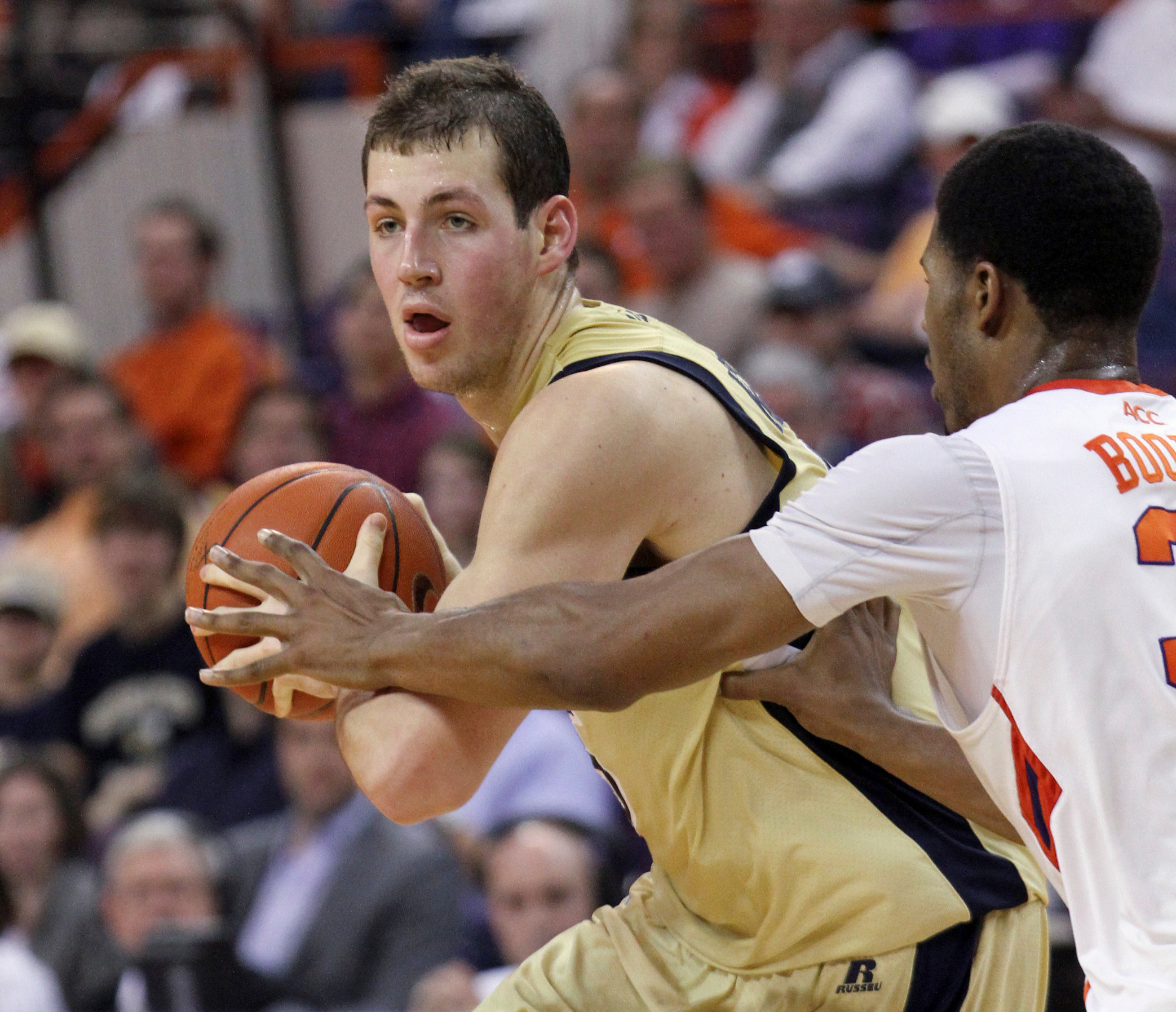 Daniel Miller protects the ball from Clemson's Devin Booker. (AP Photo/Anderson Independent-Mail, Mark Crammer)