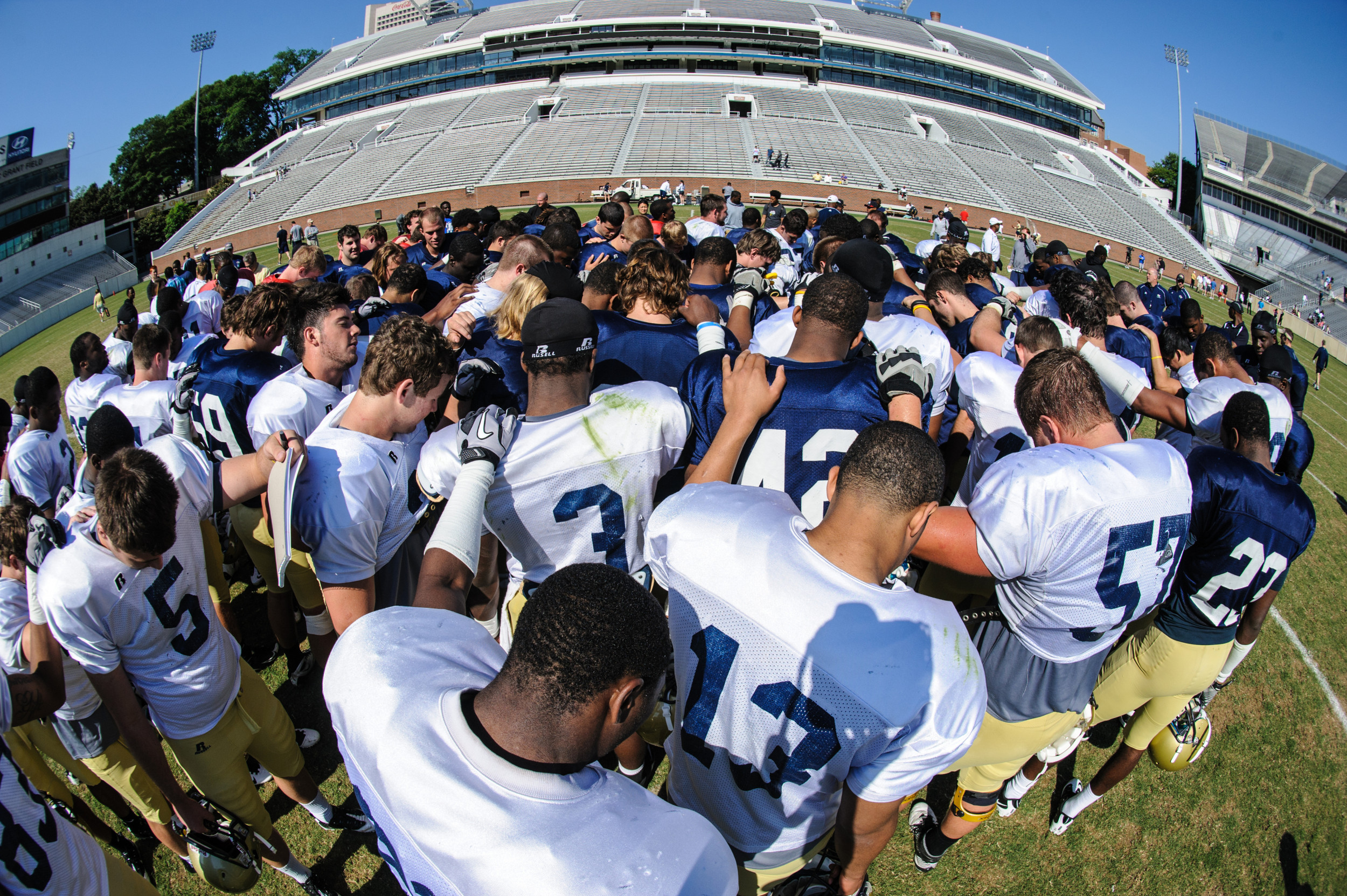 The team huddles after the scrimmage.