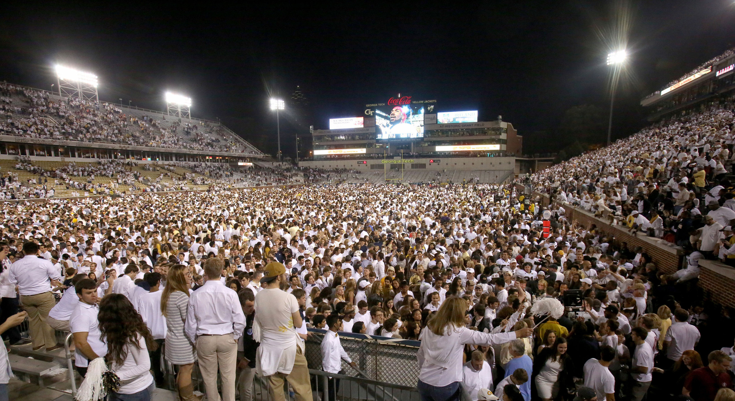 Georgia Tech Yellow Jackets fans celebrate after they stormed the field following their win over the Florida State Seminoles at Bobby Dodd Stadium. Georgia Tech won 22-16. Credit: Jason Getz-USA TODAY Sports