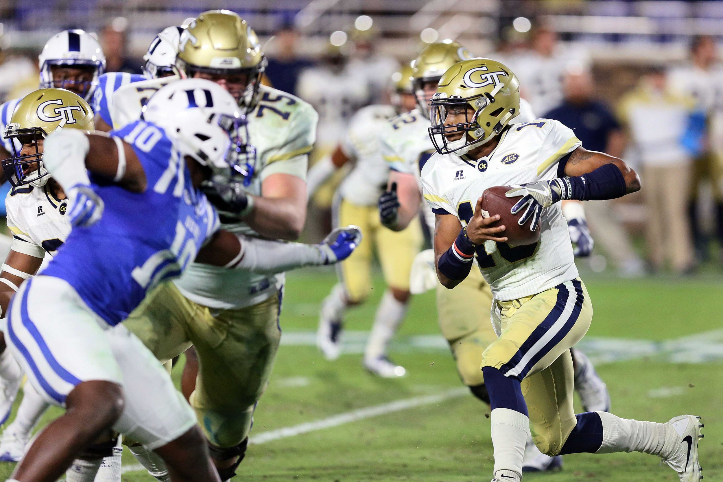 Nov 18, 2017; Durham, NC, USA; Georgia Tech Yellow Jackets quarterback TaQuon Marshall (16) keeps the ball for a run against the Duke Blue Devils in the second half at Wallace Wade Stadium. Duke beat the Georgia Tech 42-20. Mandatory Credit: Mark Dolejs-USA TODAY Sports