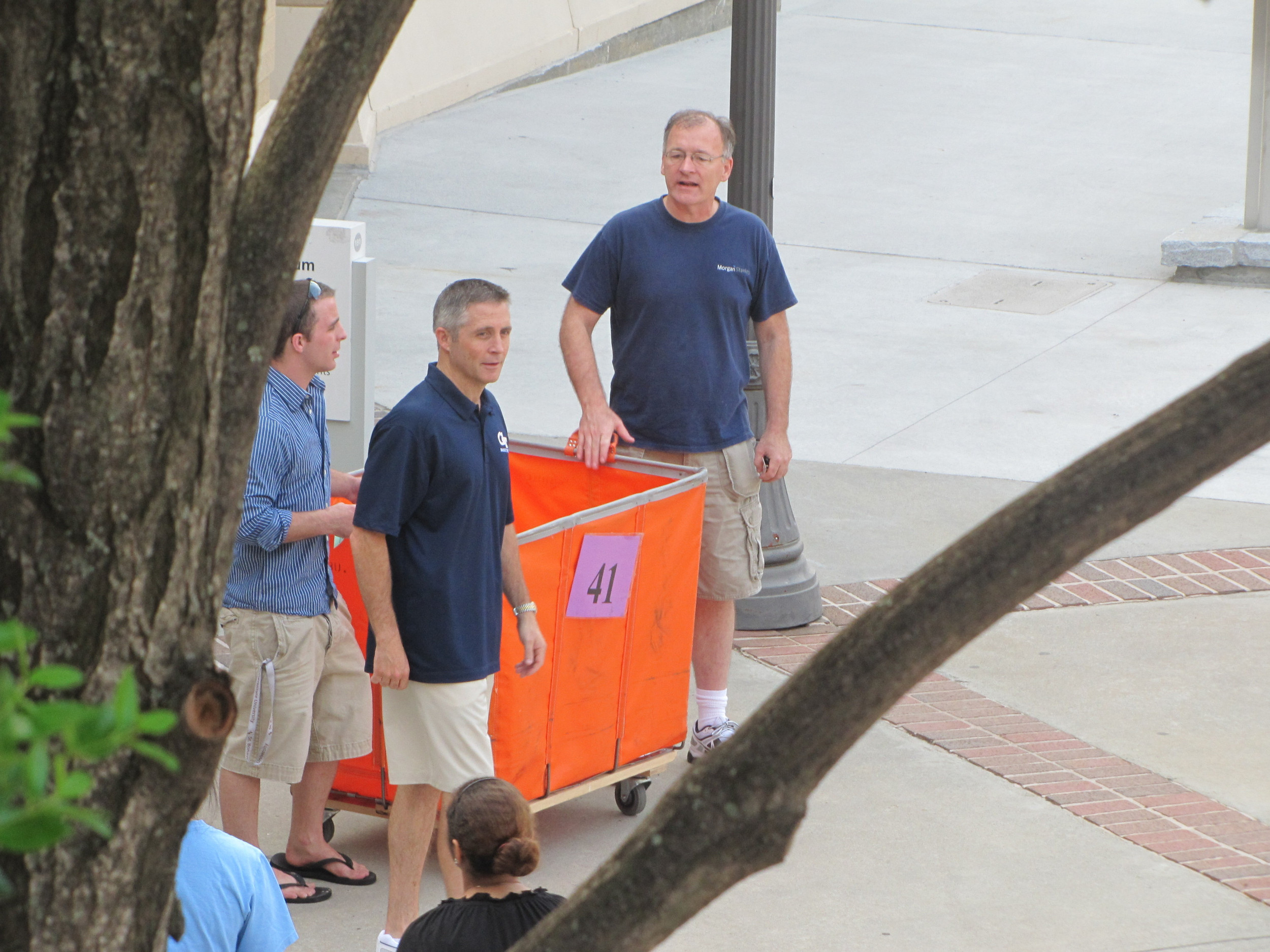 Brian Gregory greeting students at the North Avenue Apartments.