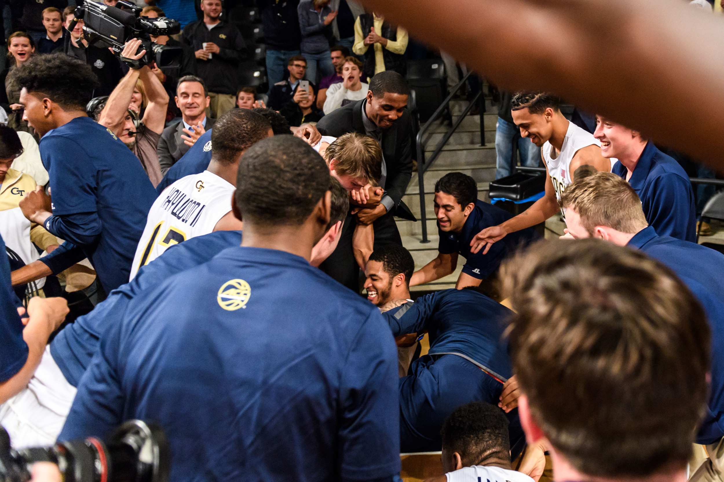 The Jackets swarm Tadric Jackson after the buzzer beater