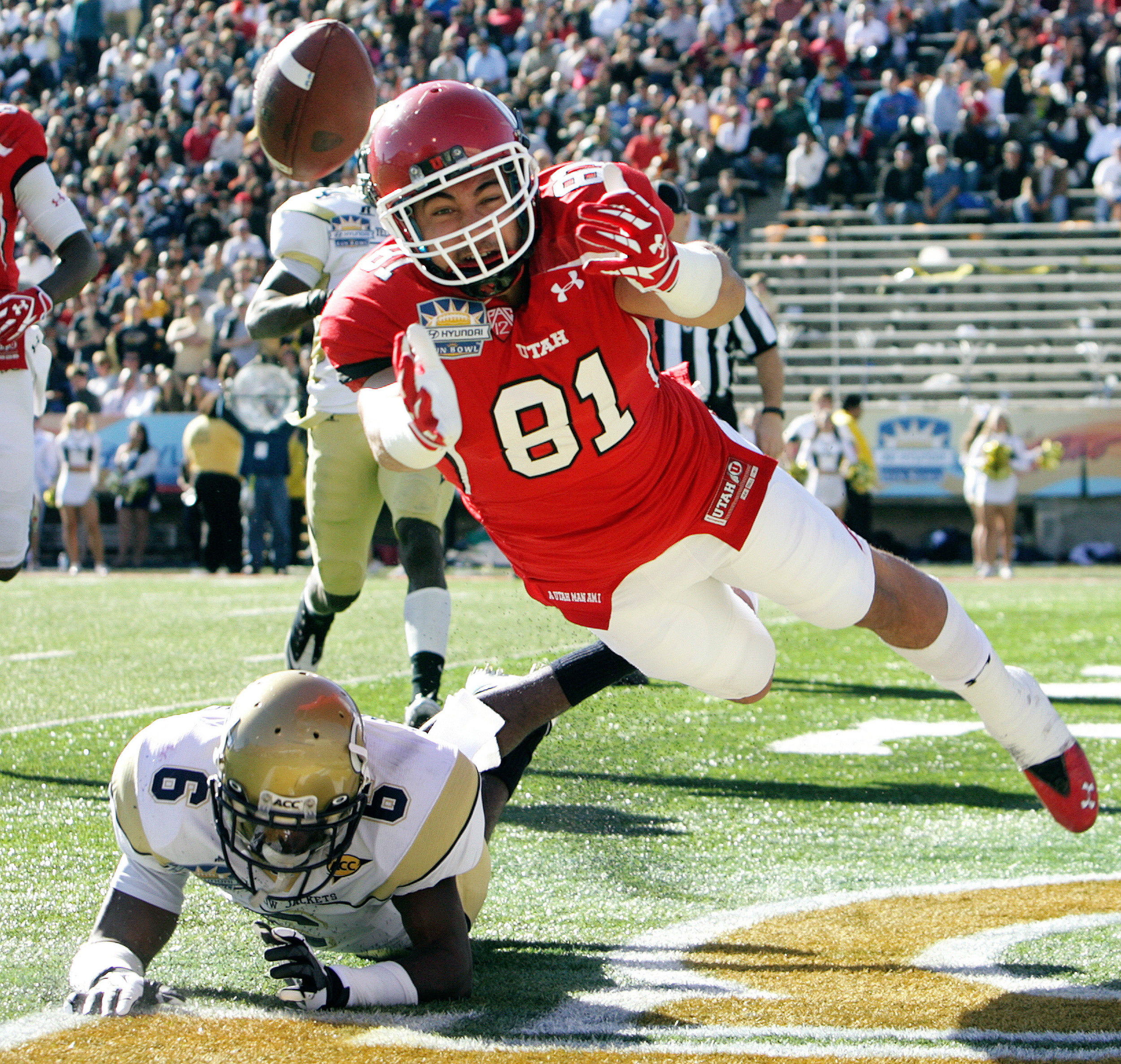 Utah tight end Kendrick Moeai (81) dives for a pass in the end zone in front of Georgia Tech defensive back Rod Sweeting during the Sun Bowl NCAA college football game on Saturday, Dec. 31, 2011, in El Paso, Texas. (AP Photo/El Paso Times, Mark Lambie) EL DIARIO OUT; JUAREZ MEXICO OUT; IF USE ON LAM OR LAT AND EL DIARIO DE EL PASO OUT