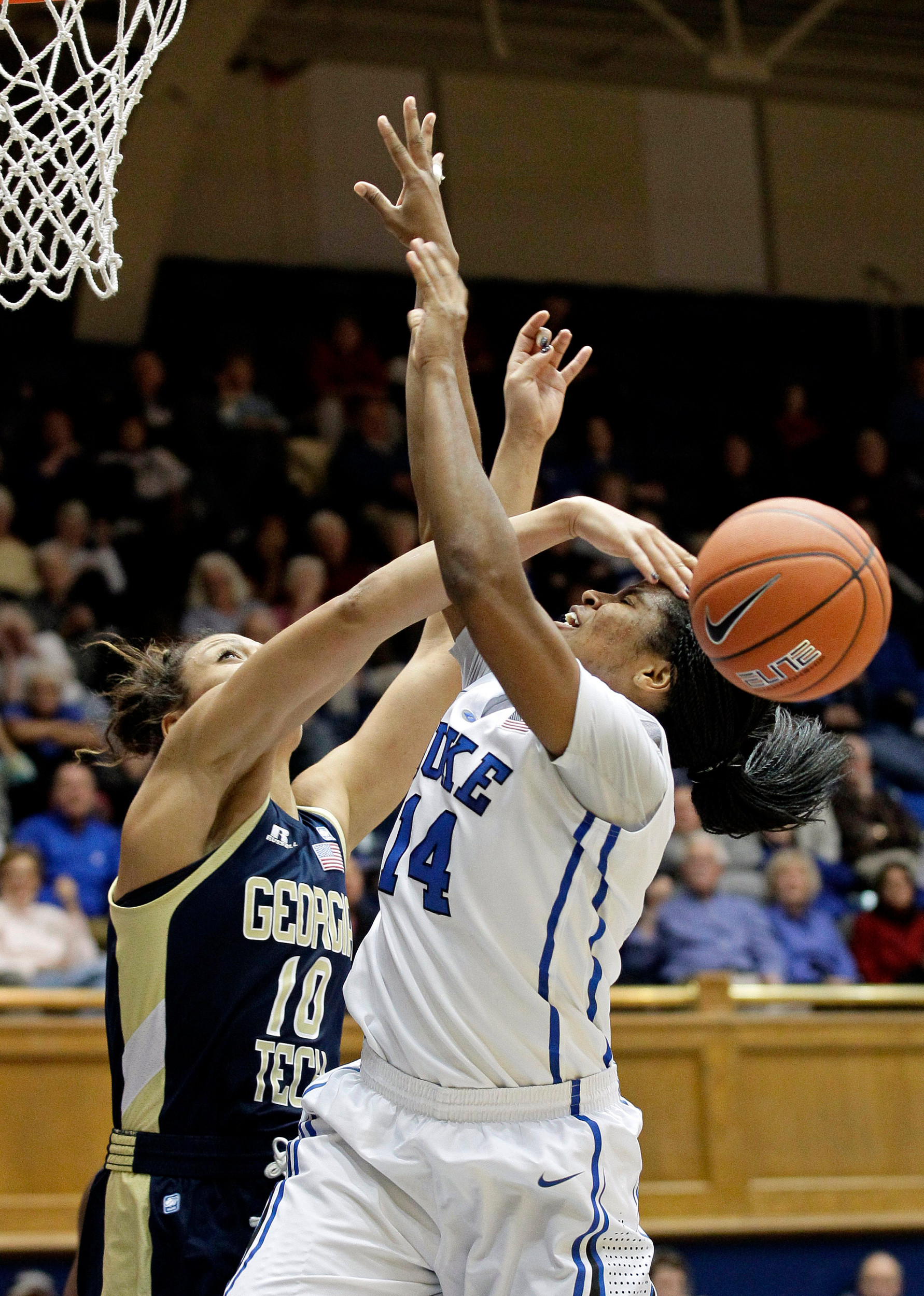 Duke's Ka'lia Johnson is blocked by Georgia Tech's Danielle Hamilton-Carter (10) during the second half of an NCAA women's college basketball game in Durham, N.C., Thursday, Dec. 6, 2012. Duke won 85-52. (AP Photo/Gerry Broome)
