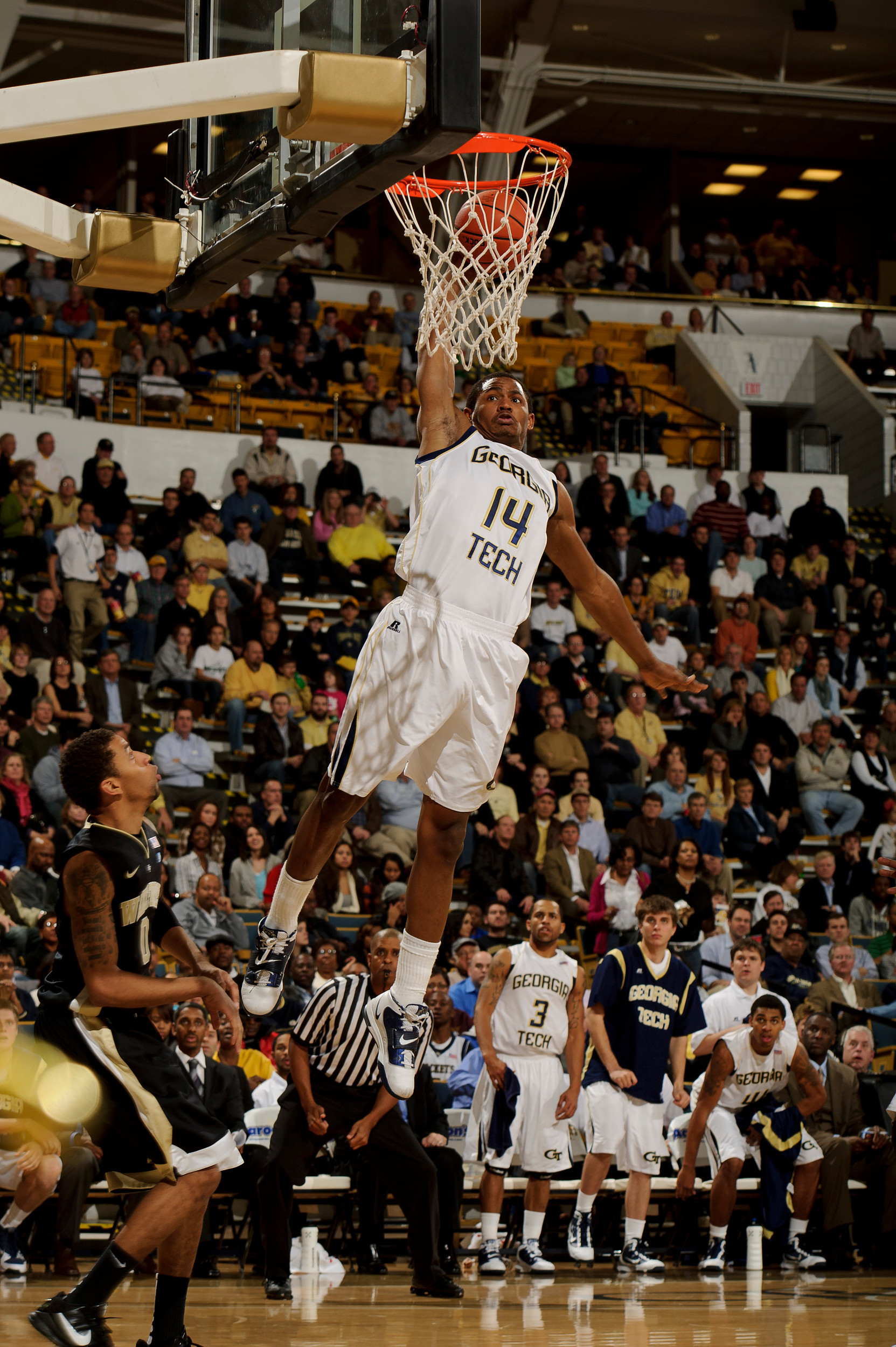 Jan 19, 2011; Atlanta, GA, USA; Georgia Tech Yellow Jackets guard Jason Morris (14) slam dunks the ball against the Wake Forest Demon Deacons during the second half at Alexander Memorial Coliseum. Georgia Tech defeated Wake Forest 74-39. Mandatory Credit: Paul Abell-US PRESSWIRE