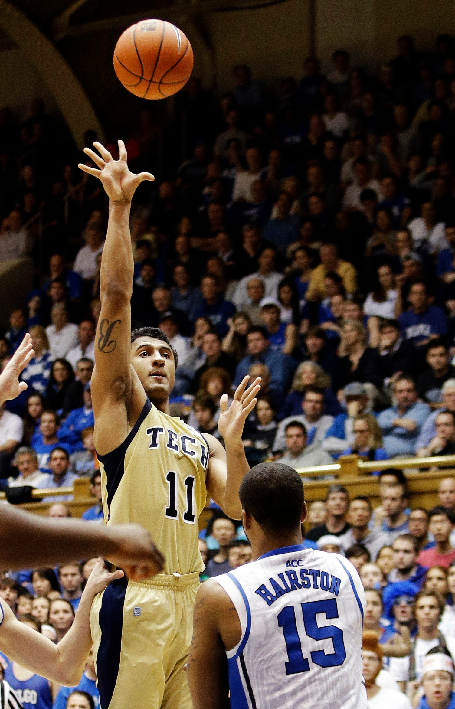 Georgia Tech's Chris Bolden (11) shoots over Duke's Josh Hairston (15) during the second half. (AP Photo/Gerry Broome)