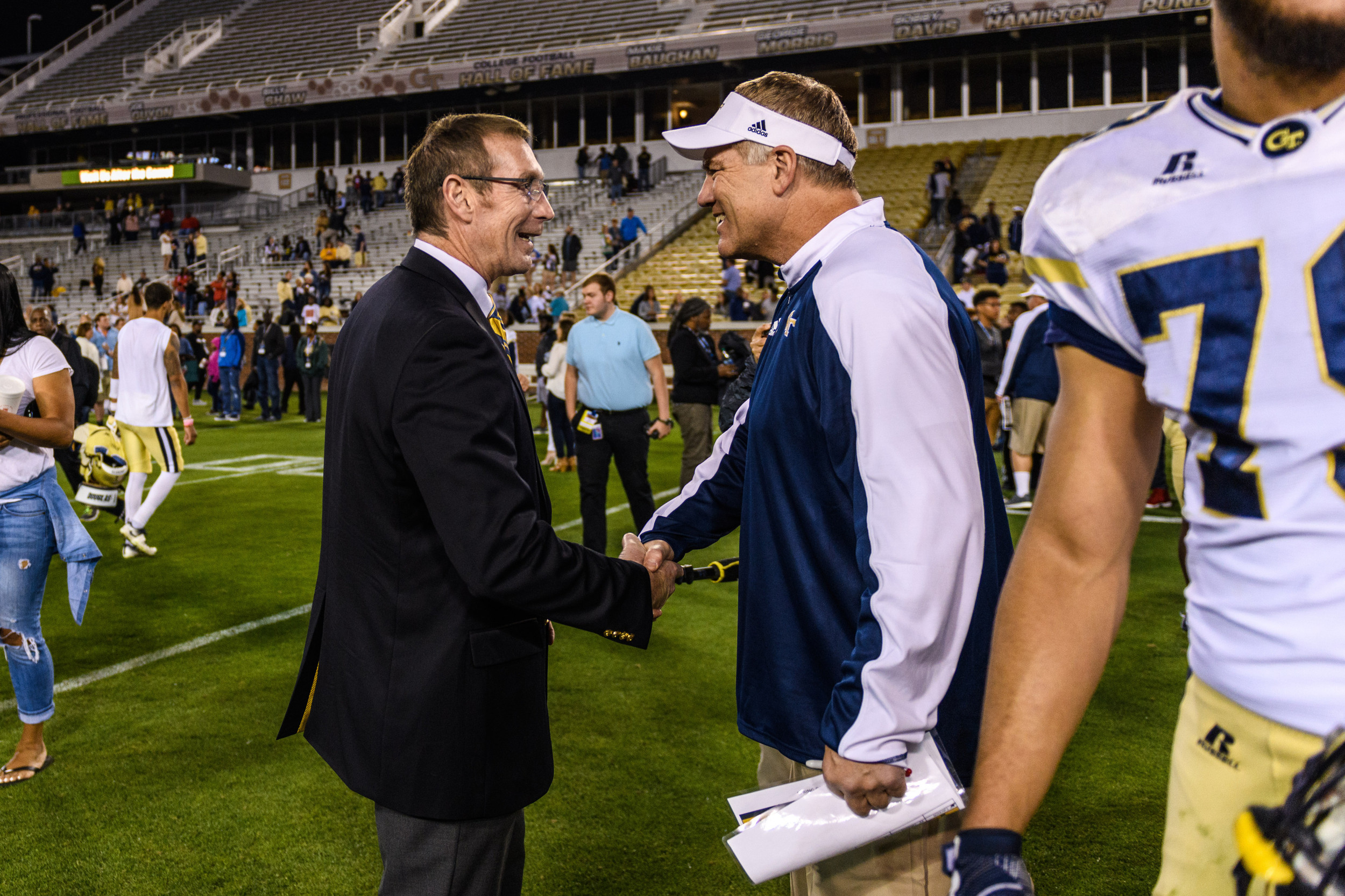 Director of Athletics Todd Stansbury, Defensive Coordinator Nate Woody