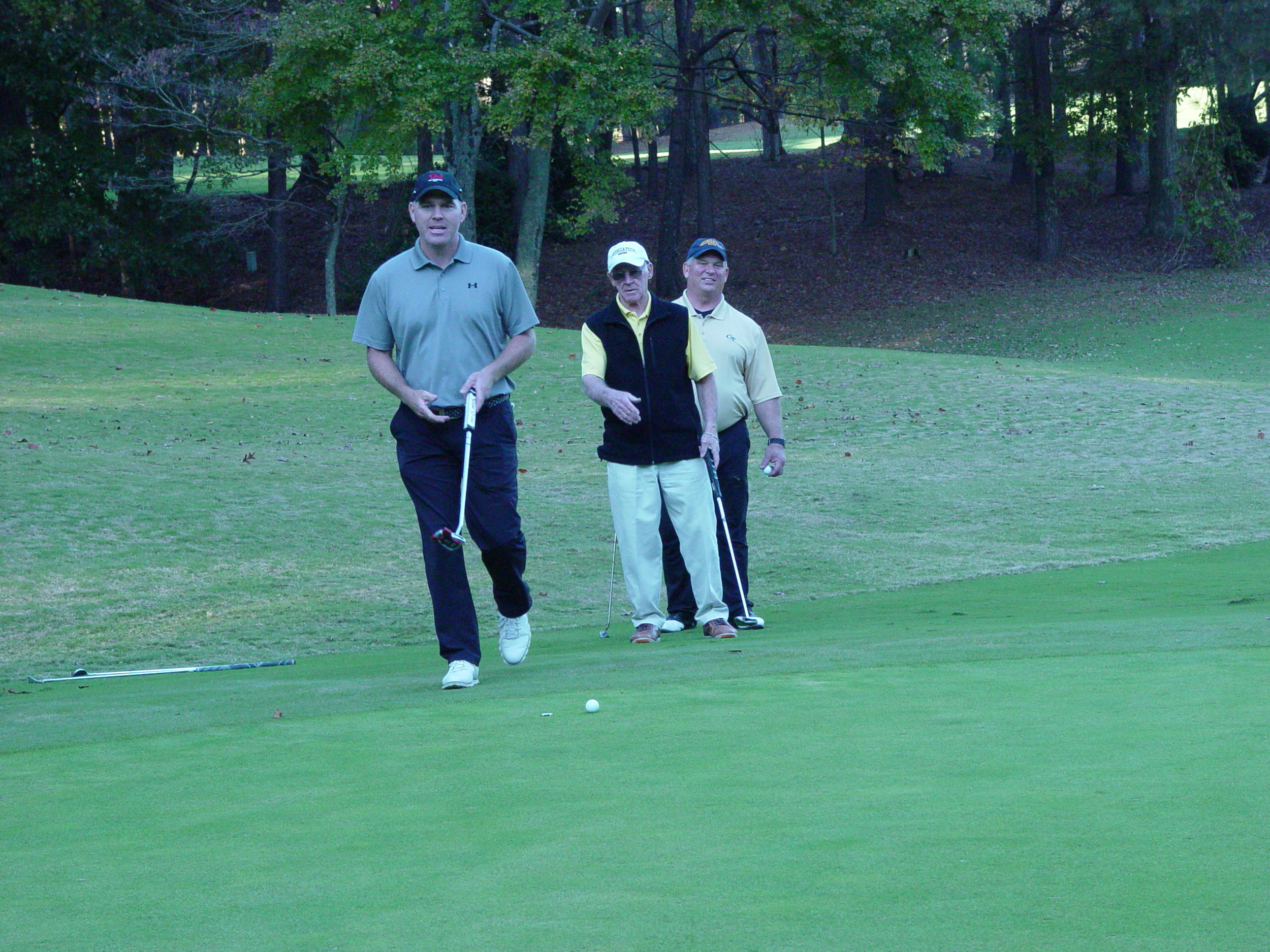 Former Jacket Troy Matteson looks at a putt with alumni Jon Martin and Sam Kelly at the Ramblin' Wreck Cup, November 12, 2017