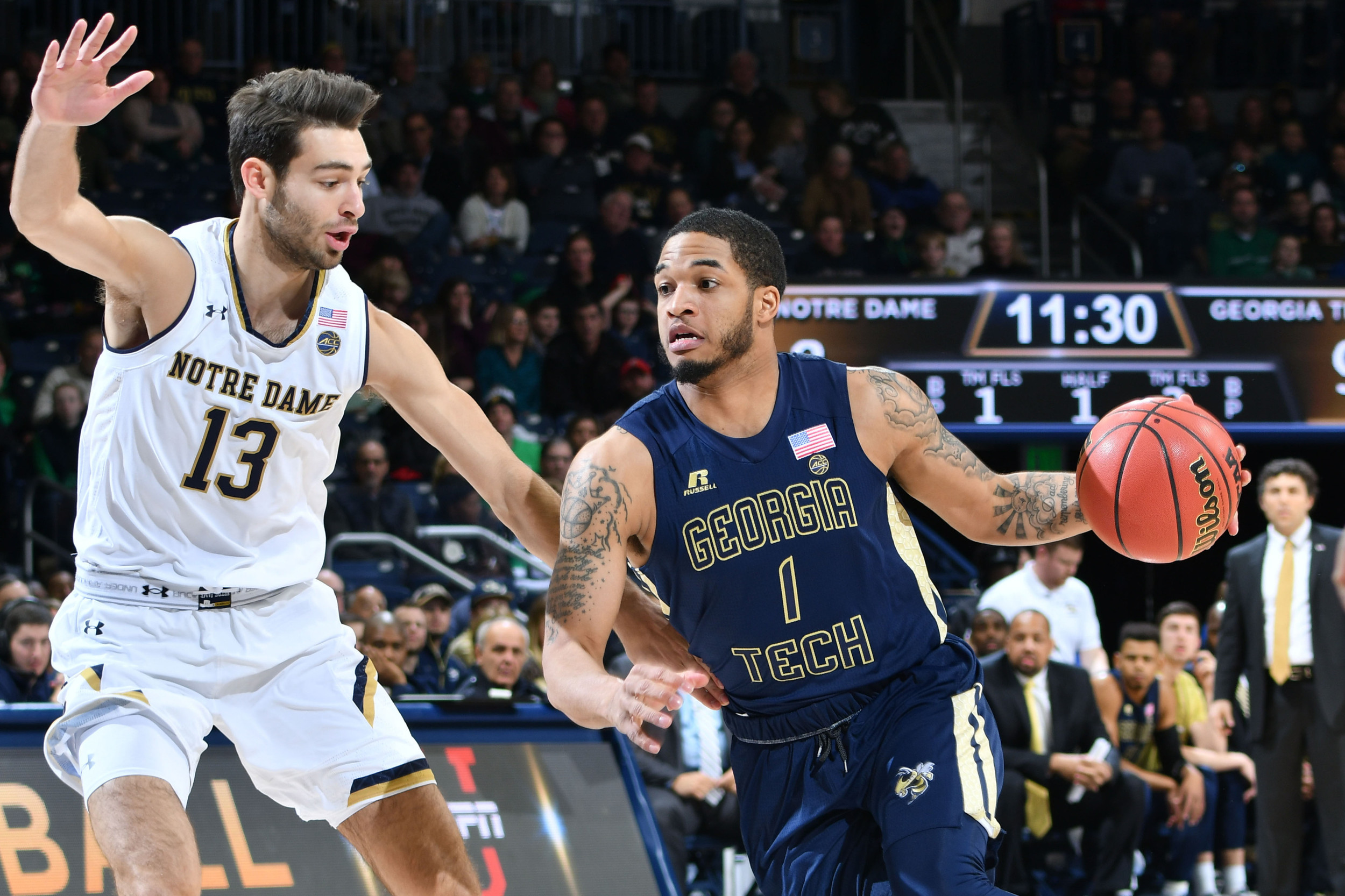 Dec 30, 2017; South Bend, IN, USA; Georgia Tech Yellow Jackets guard Tadric Jackson (1) dribbles as Notre Dame Fighting Irish guard Nikola Djogo (13) defends in the first half at the Purcell Pavilion. Mandatory Credit: Matt Cashore-USA TODAY Sports