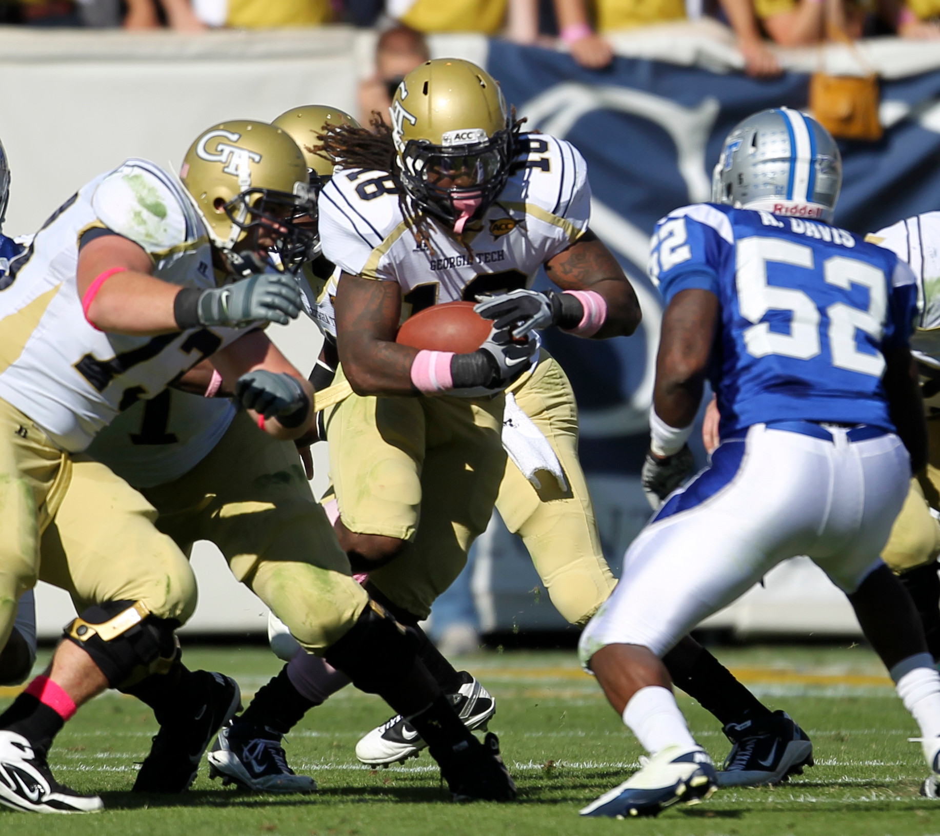 Georgia Tech running back Anthony Allen (18) carries the ball toward the defense of Middle Tennessee linebacker Antwan Davis (52) during the first quarter of an NCAA college football game Saturday, Oct. 16, 2010, in Atlanta. (AP Photo/David Goldman)