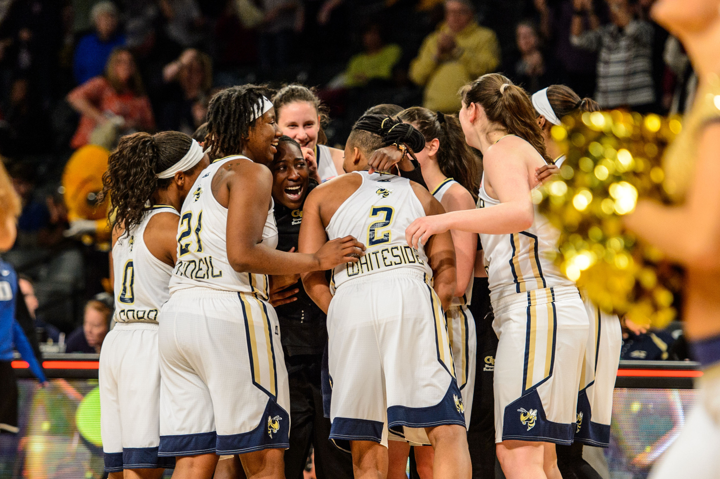 The team celebrates the win over #16 Duke