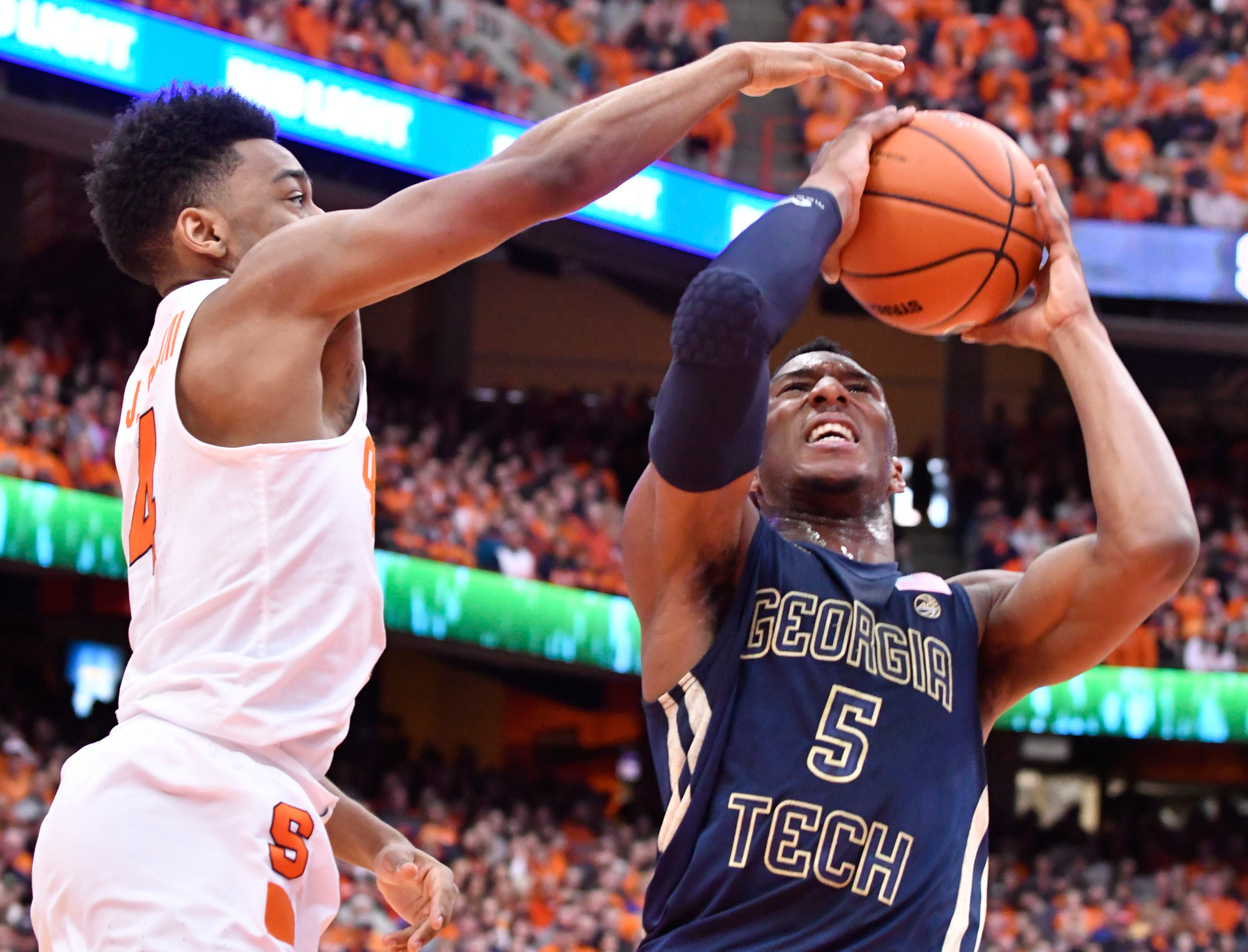 Mar 4, 2017; Syracuse, NY, USA; Georgia Tech Yellow Jackets guard Josh Okogie (5) is closely defended by Syracuse Orange guard John Gillon (4) as he attempts a shot. Mark Konezny-USA TODAY Sports