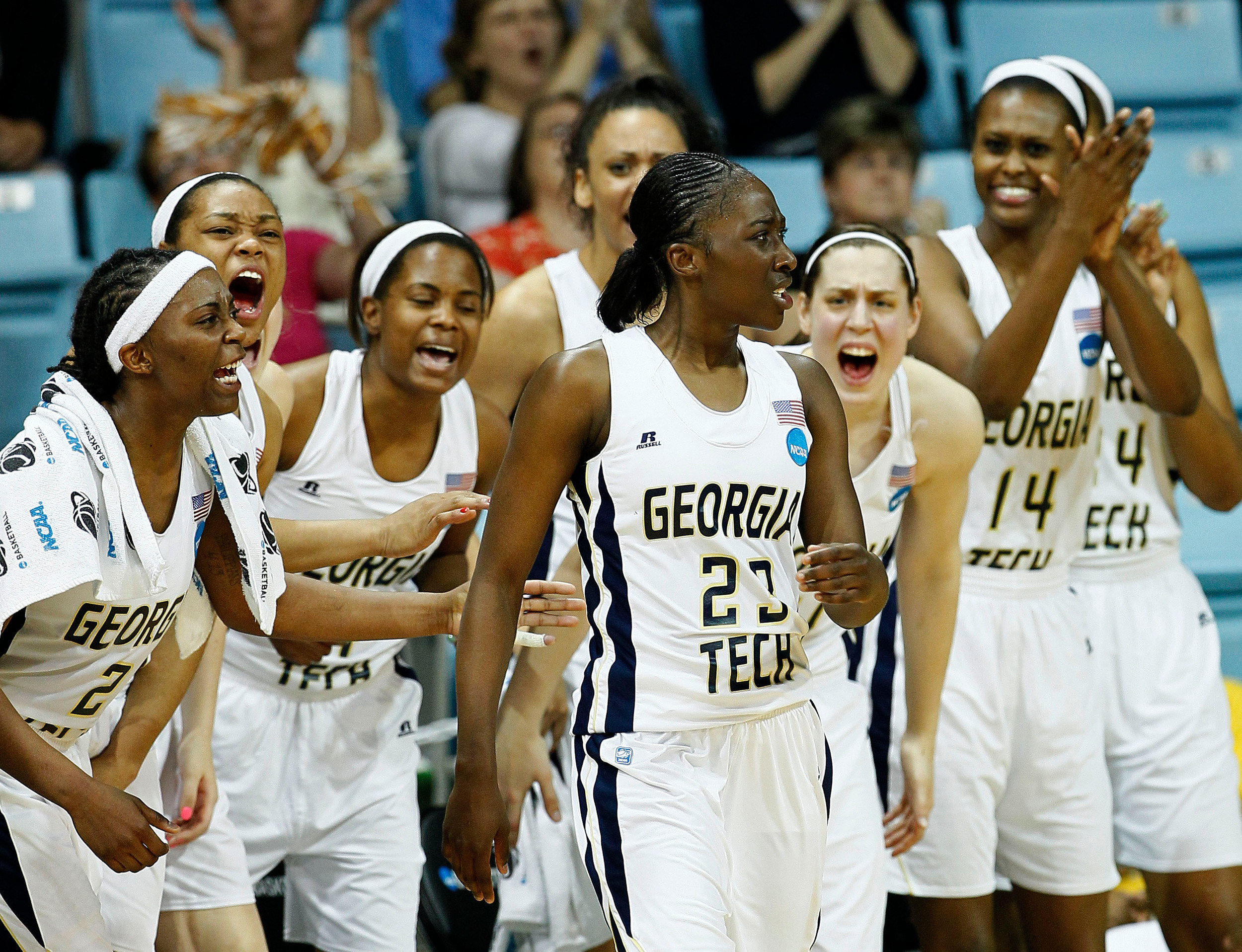 Georgia Tech's Sydney Wallace (23) is congratulated by teammates at the bench following a 3-point shot during the second half. Georgia Tech won 76-64. (AP Photo/Gerry Broome)