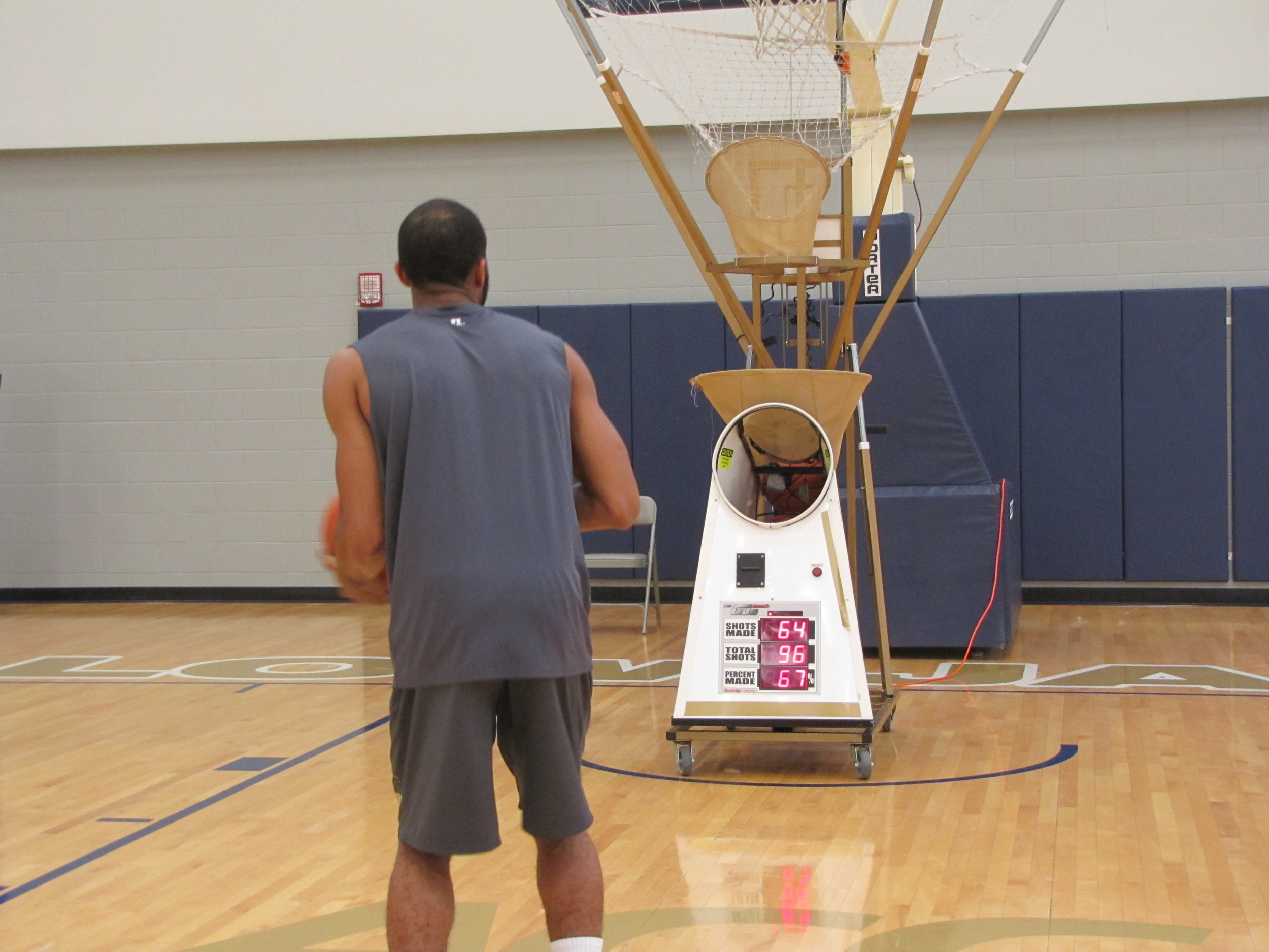Adam Smith wants to make 300-plus shots a day this summer to get ready for his senior season. Here he gets his shots up on June 30, 2015, at Zelnak Center.