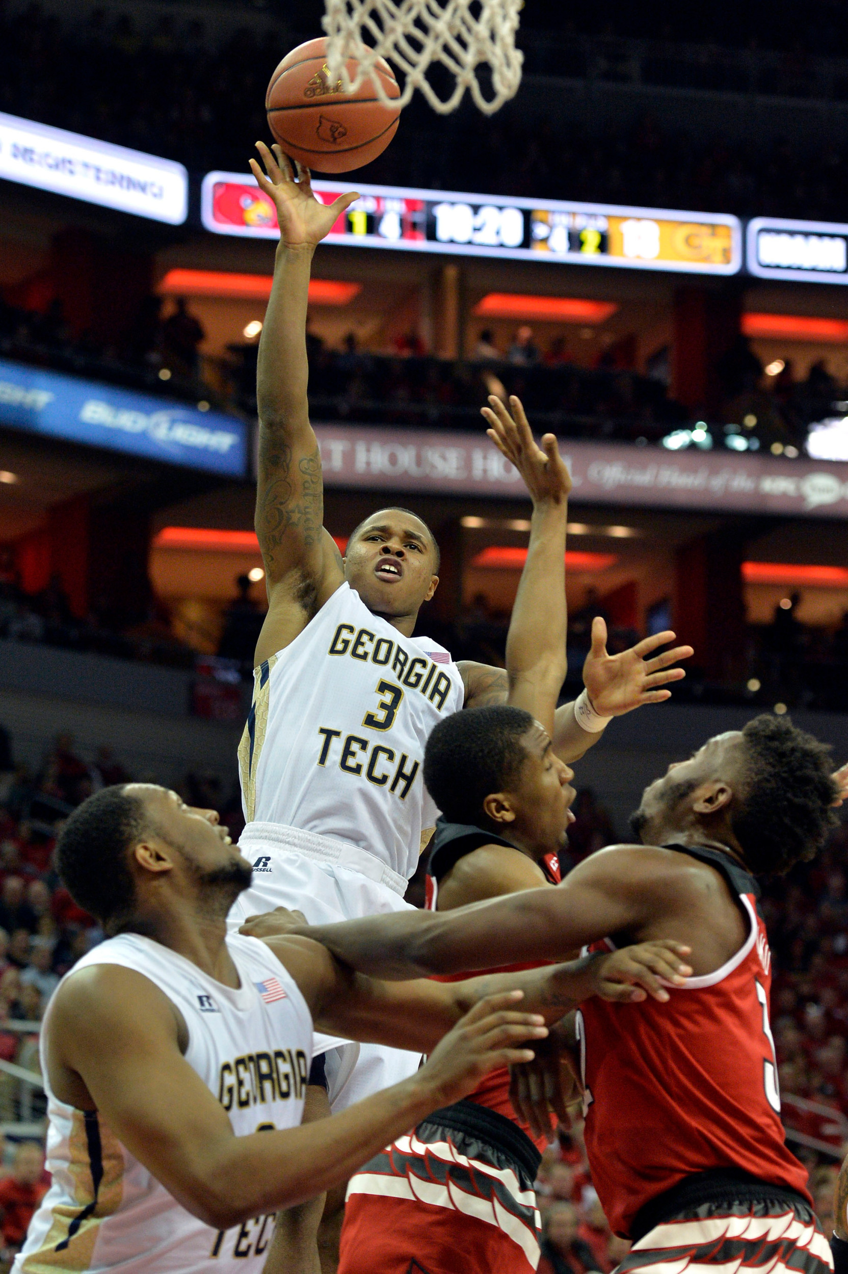 Marcus Georges-Hunt shoots against Louisville Cardinals guard Donovan Mitchell (45) and center Chinanu Onuaku (32) during the first half at KFC Yum! Center. Jamie Rhodes-USA TODAY Sports