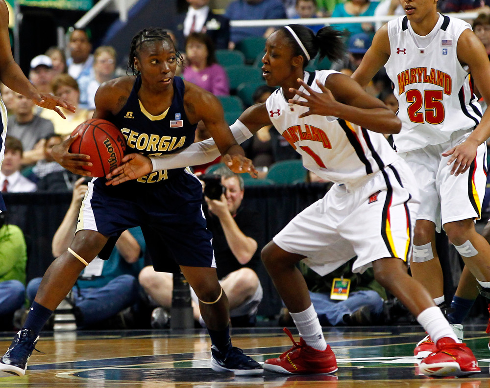Maryland's Laurin Mincy (1) reaches in on Georgia Tech's Tyaunna Marshall (15) during the Championship game of the 2012 ACC Women's Basketball Tournament in Greensboro, NC, March 4, 2012. (Photo by Mark W. Sutton , theACC.com)