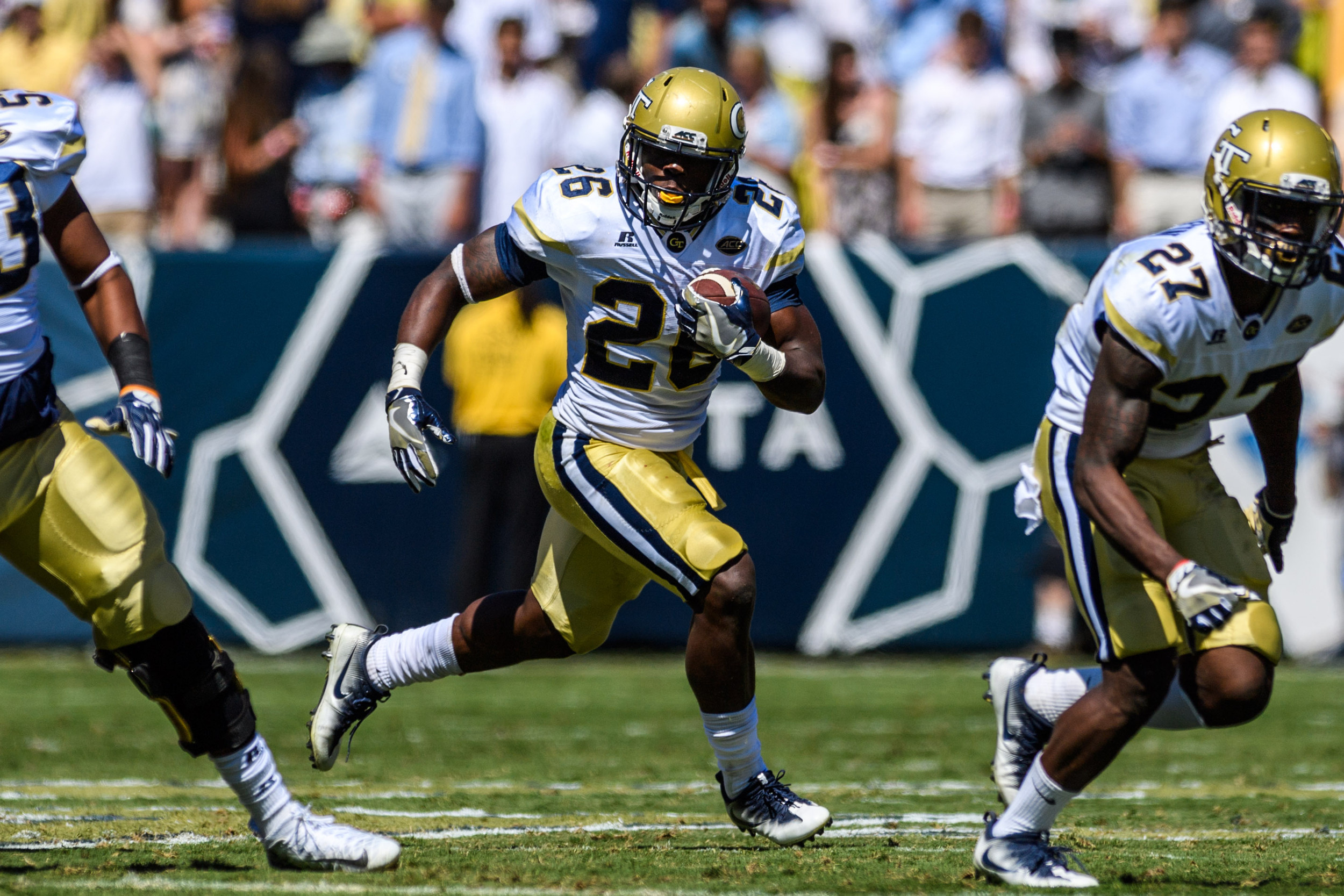 Dedrick Mills (26) looks for a hole downfield on the run versus No. 14 Miami (Oct. 1, 2016).