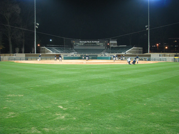 Softball team practices at night for the first time in its new stadium.