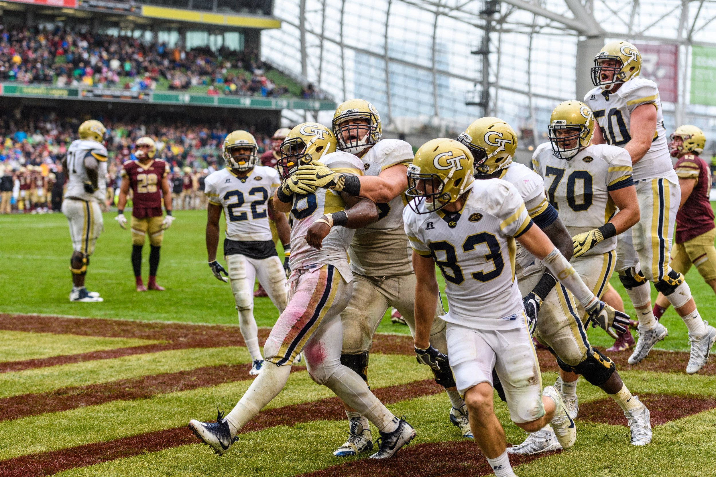 Georgia Tech B-Back Dedrick Mills (26) celebrates with teammates after scoring a touchdown during the second half of an NCAA football game, Saturday, Sept. 3, 2016, in Dublin, Ireland. (Danny Karnik/Georgia Tech via AP)