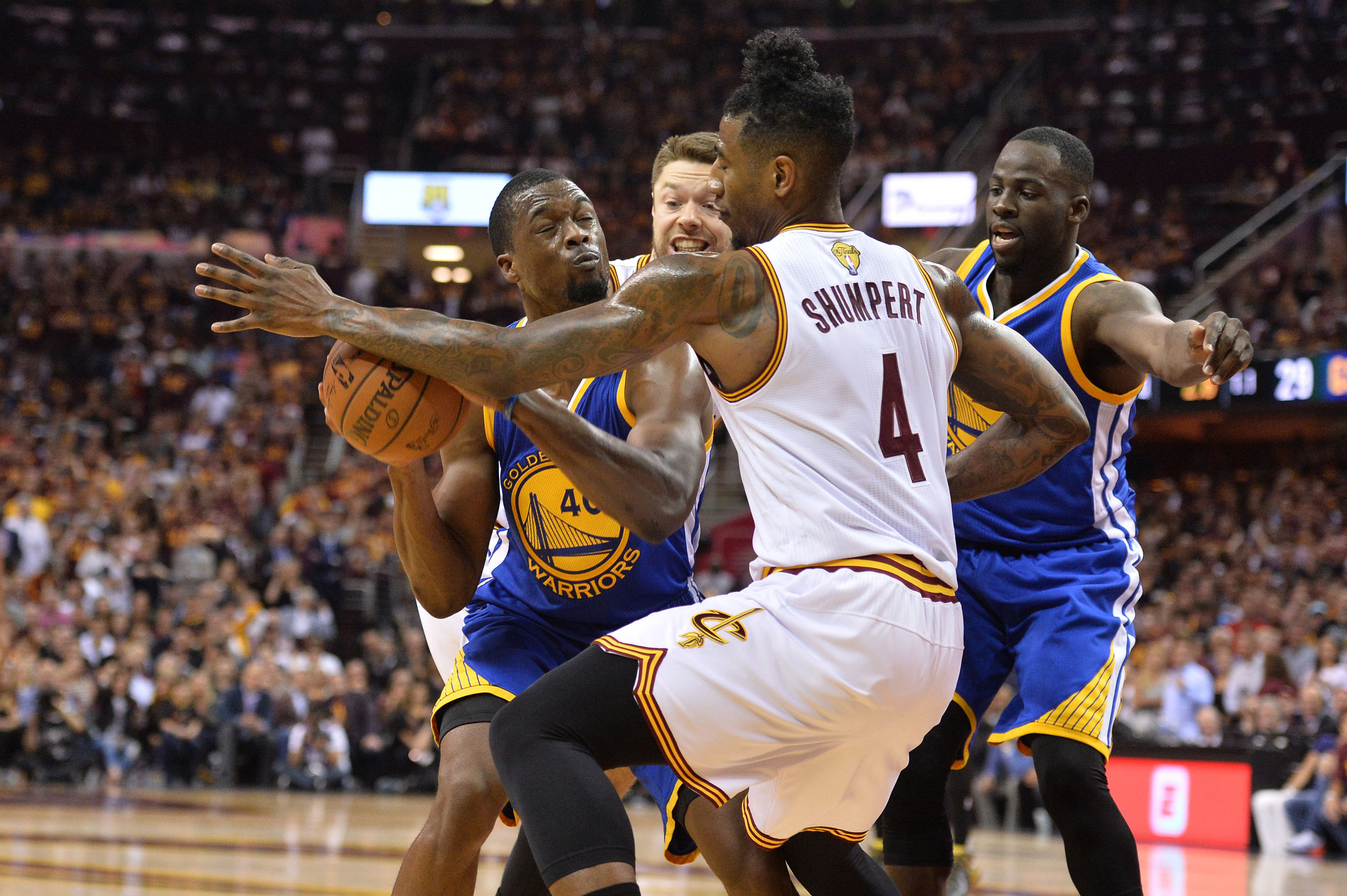 Jun 10, 2016; Cleveland, OH, USA; Golden State Warriors forward Harrison Barnes (40) controls the ball against Cleveland Cavaliers guards Matthew Dellavedova (8) and Iman Shumpert (4) during game four of the NBA Finals. Credit: Ken Blaze-USA TODAY Sports