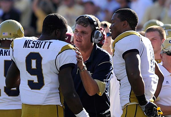 Head Coach Paul Johnson talks with Josh Nesbitt (9) after a score. Photo by LensEffects