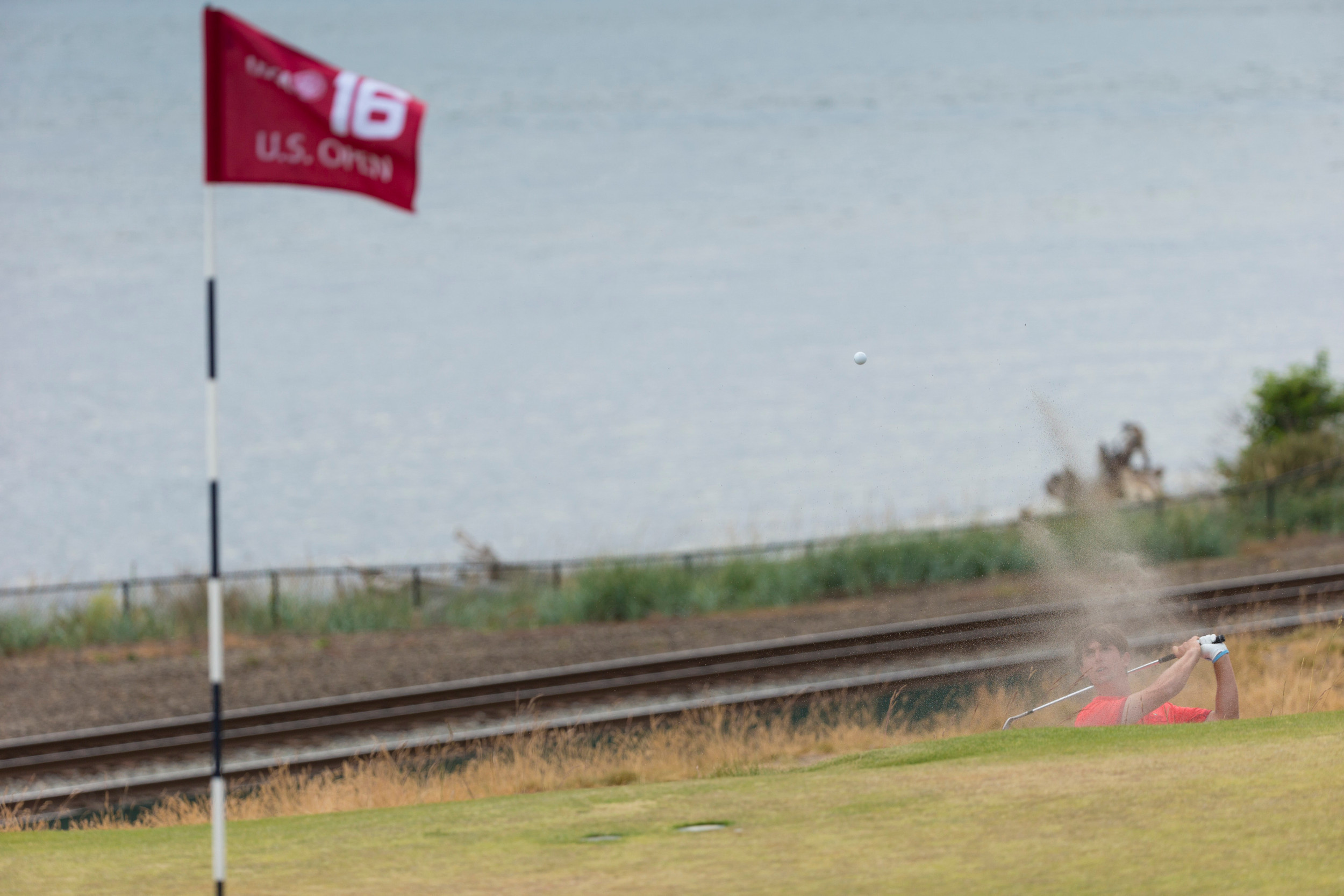 Oliver Schniederjans plays his shot out of a greenside bunker on the 16th hole during the first round of the 2015 U.S. Open at Chambers Bay in University Place, Wash. on Thursday, June 18, 2015. (Copyright USGA/Darren Carroll)
