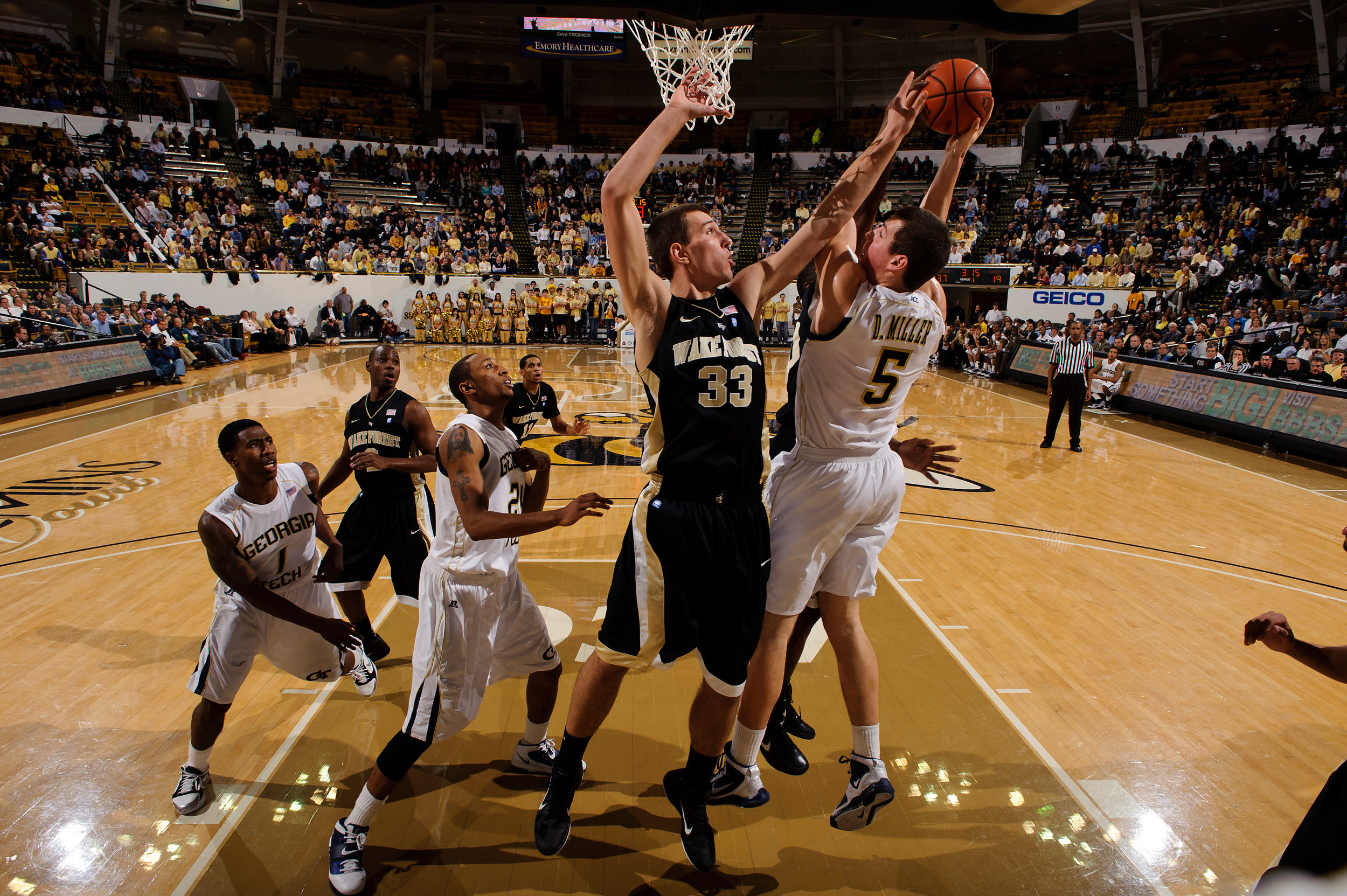 Jan 19, 2011; Atlanta, GA, USA; Georgia Tech Yellow Jacket center Daniel Miller (5) shoots over Wake Forest Demon Deacons center Carson Desrosiers (33) during the first half at Alexander Memorial Coliseum. Georgia Tech defeated Wake Forest 74-39. Mandatory Credit: Paul Abell-US PRESSWIRE