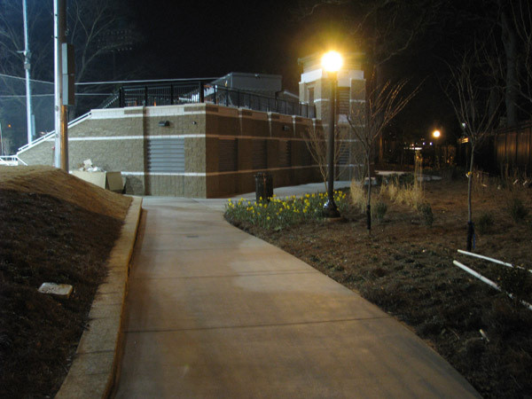 Softball team practices at night for the first time in its new stadium.
