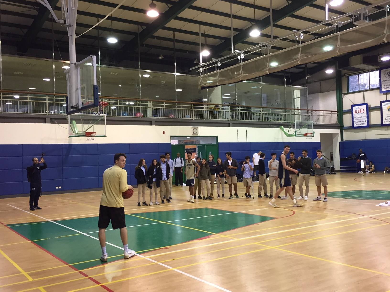 The Yellow Jackets have some fun with a dunking demonstration for the students of Hangzhou International School following Monday afternoon's practice, November 6, 2017.