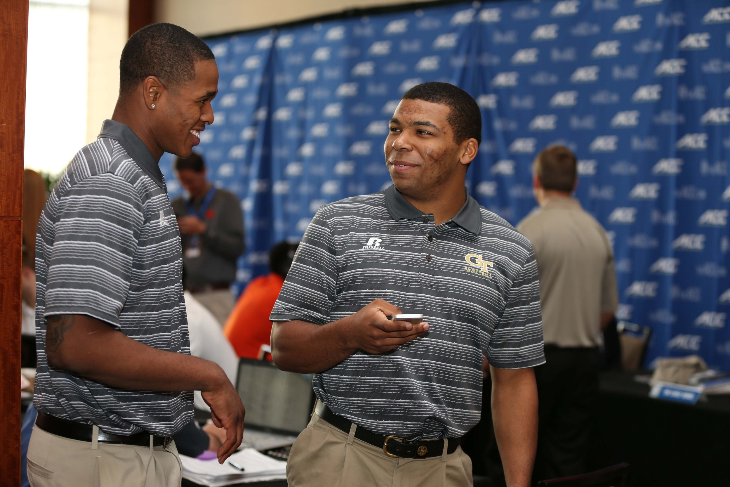 Oct 29, 2014; Charlotte, NC, USA; Marcus Georges-Hunt and Corey Heyward of the Georgia Tech Yellow Jackets enjoy a break during ACC basketball media day at The Westin. Mandatory Credit: Jim Dedmon-USA TODAY Sports