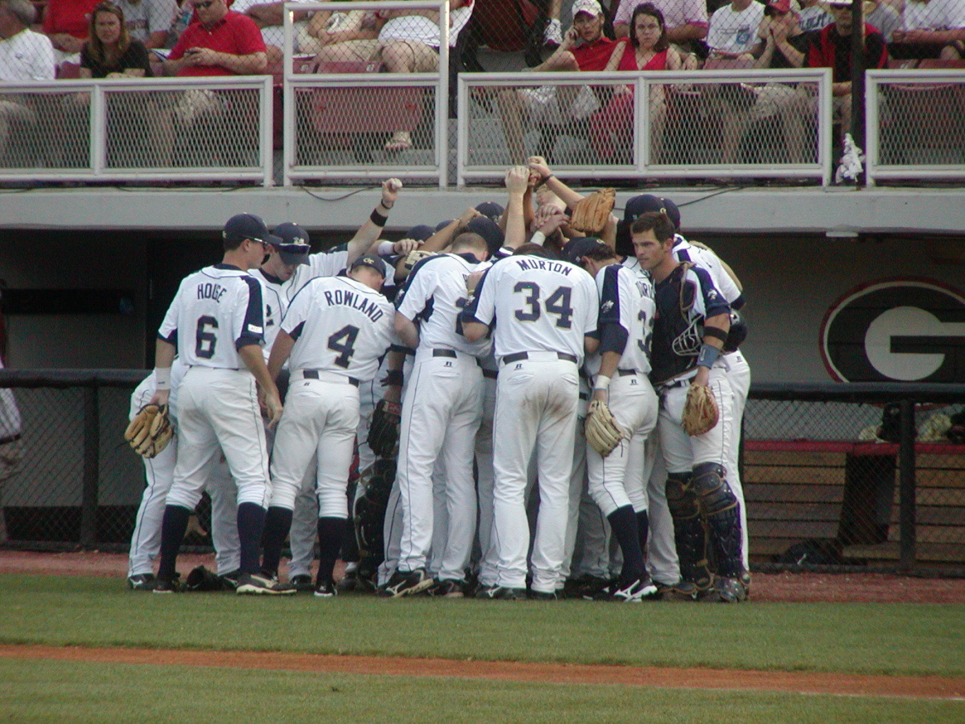 Tech huddles before taking the field.