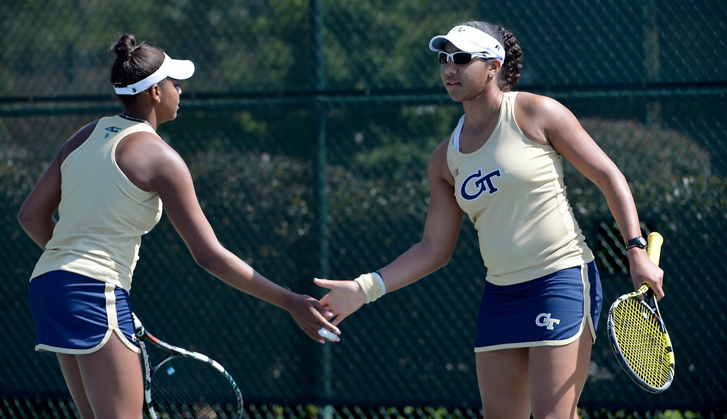Georgia Tech's Rasheeda McAdoo and Johnnise Renaud slap hands during their doubles match against Duke during the 2015 ACC Women's Tennis Tournament in Cary, N.C., April. 24, 2015. (Photo by Sara D. Davis, theACC.com)