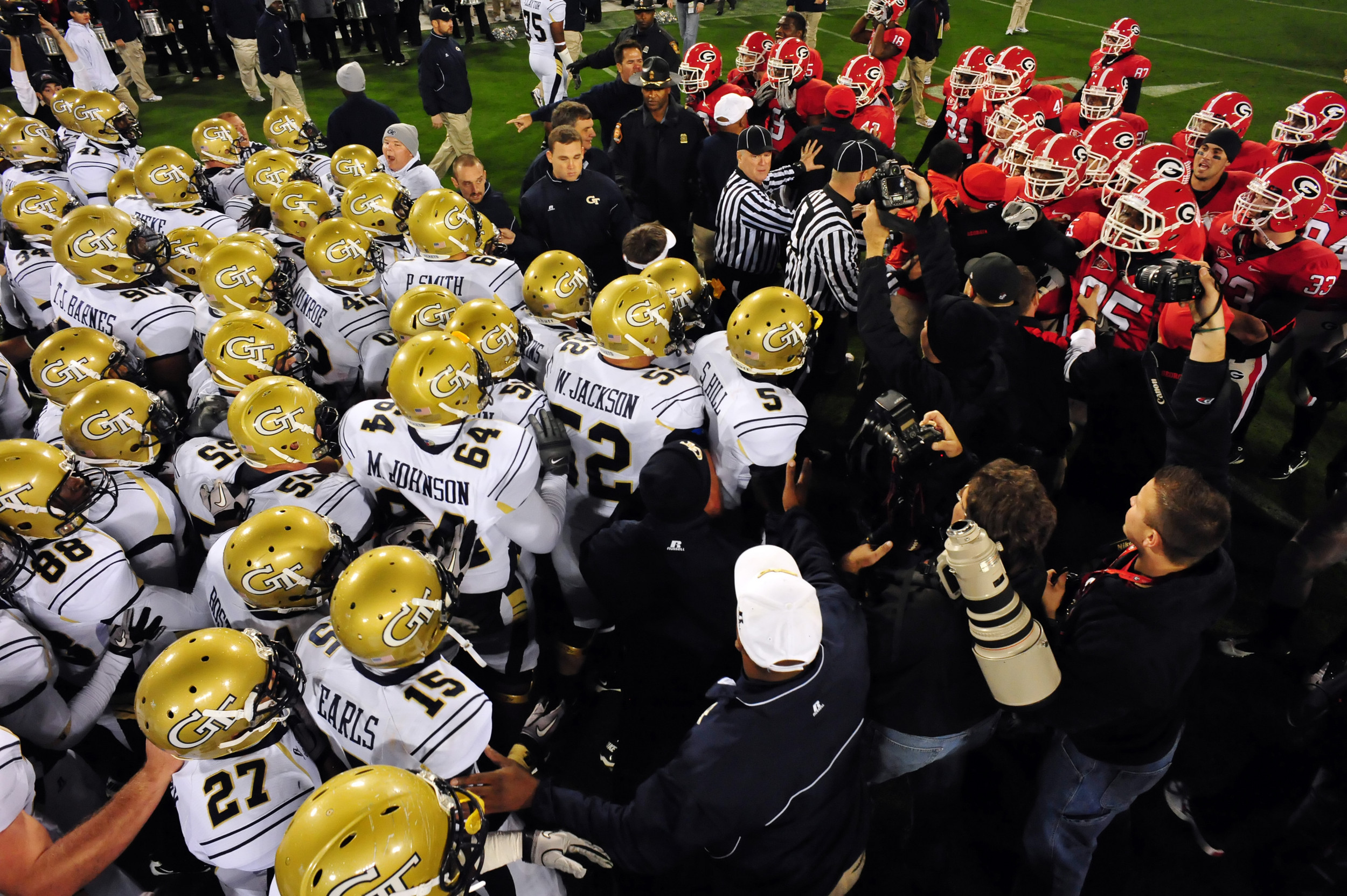Georgia Tech and Georgia players meet mid-field as the teams conclude pre-game warm ups.Georgia Tech at GeorgiaNovember 27, 2010Athens, GAPhoto by LensEffects
