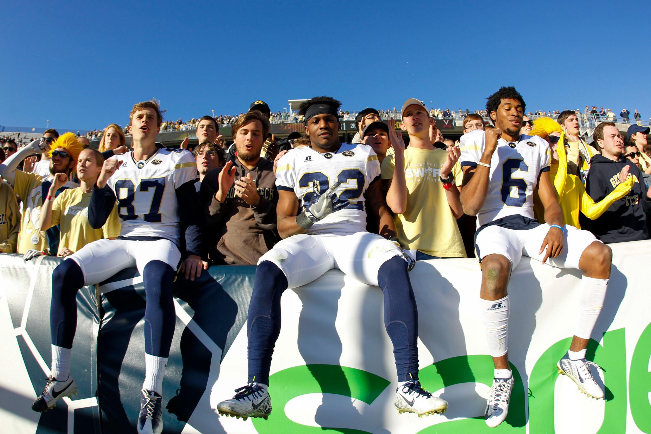 Yellow Jackets place kicker Harrison Butker (87) and running back Clinton Lynch (22) and defensive back Lamont Simmons (6) celebrate a victory against the Virginia Cavaliers at Bobby Dodd Stadium. Georgia Tech defeated Virginia 31-17. Brett Davis-USA TODAY Sports
