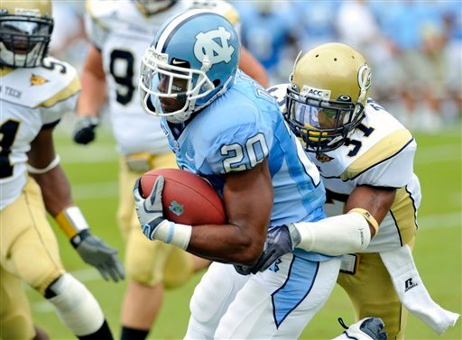 North Carolina tailback Shaun Draughn (20) is tackled by Georgia Tech cornerback Jerrard Tarrant (37) during the first quarter of an NCAA college football game, at Bobby Dodd Stadium, Saturday, Sept. 26, 2009, in Atlanta. (AP Photo/Gregory Smith)