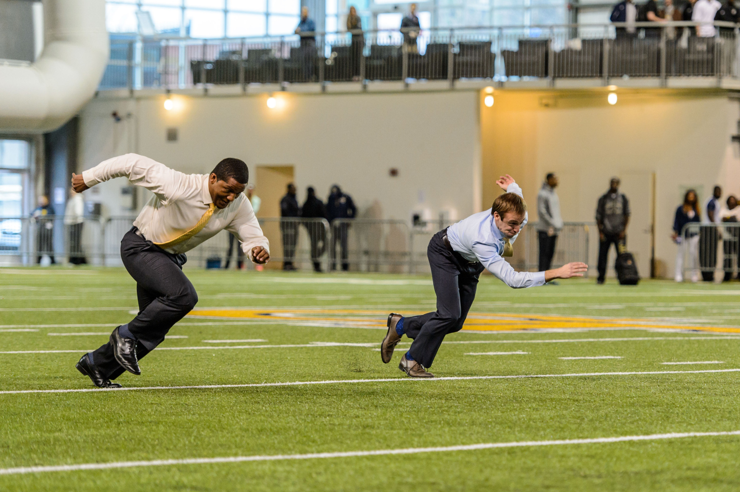 Roddy Jones and Brandon Gaudin race in the 40-yard dash after the broadcast