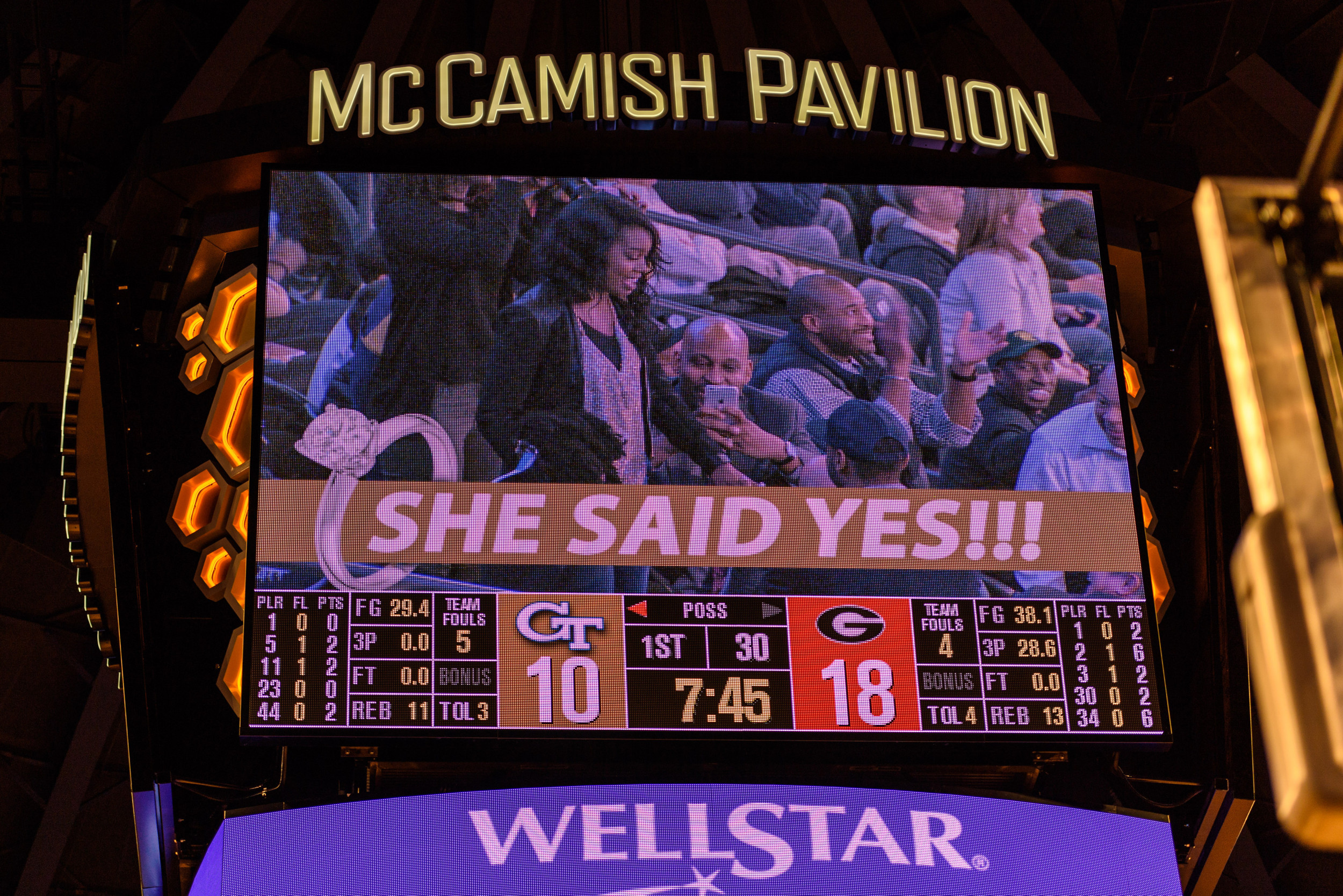Alumni Kam Holsey proposed to his girlfriend during the Kiss Cam and she said yes!