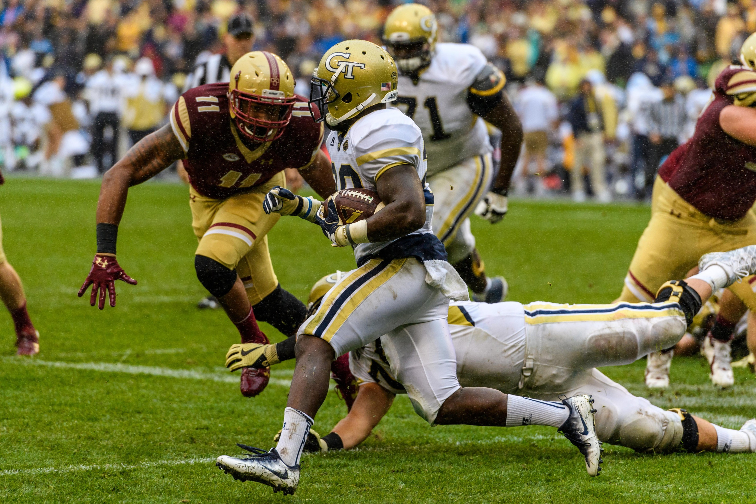 Georgia Tech B-Back Dedrick Mills (26) evades Boston College Defensive End Wyatt Ray (11) during the first half of an NCAA football game, Saturday, Sept. 3, 2016, in Dublin, Ireland. (Danny Karnik/Georgia Tech via AP)