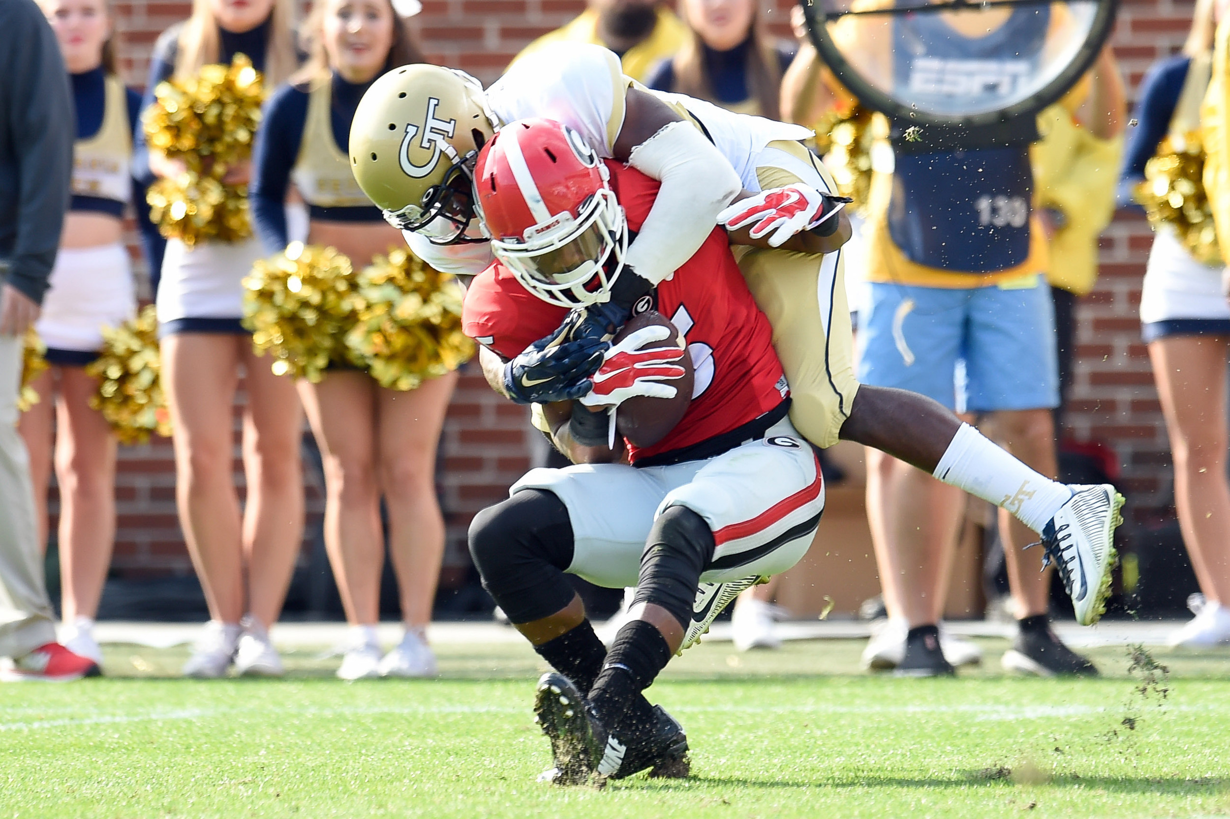Georgia Bulldogs wide receiver Terry Godwin (5) is tackled by Georgia Tech Yellow Jackets defensive back D.J. White (28) during the second half at Bobby Dodd Stadium. Dale Zanine-USA TODAY Sports