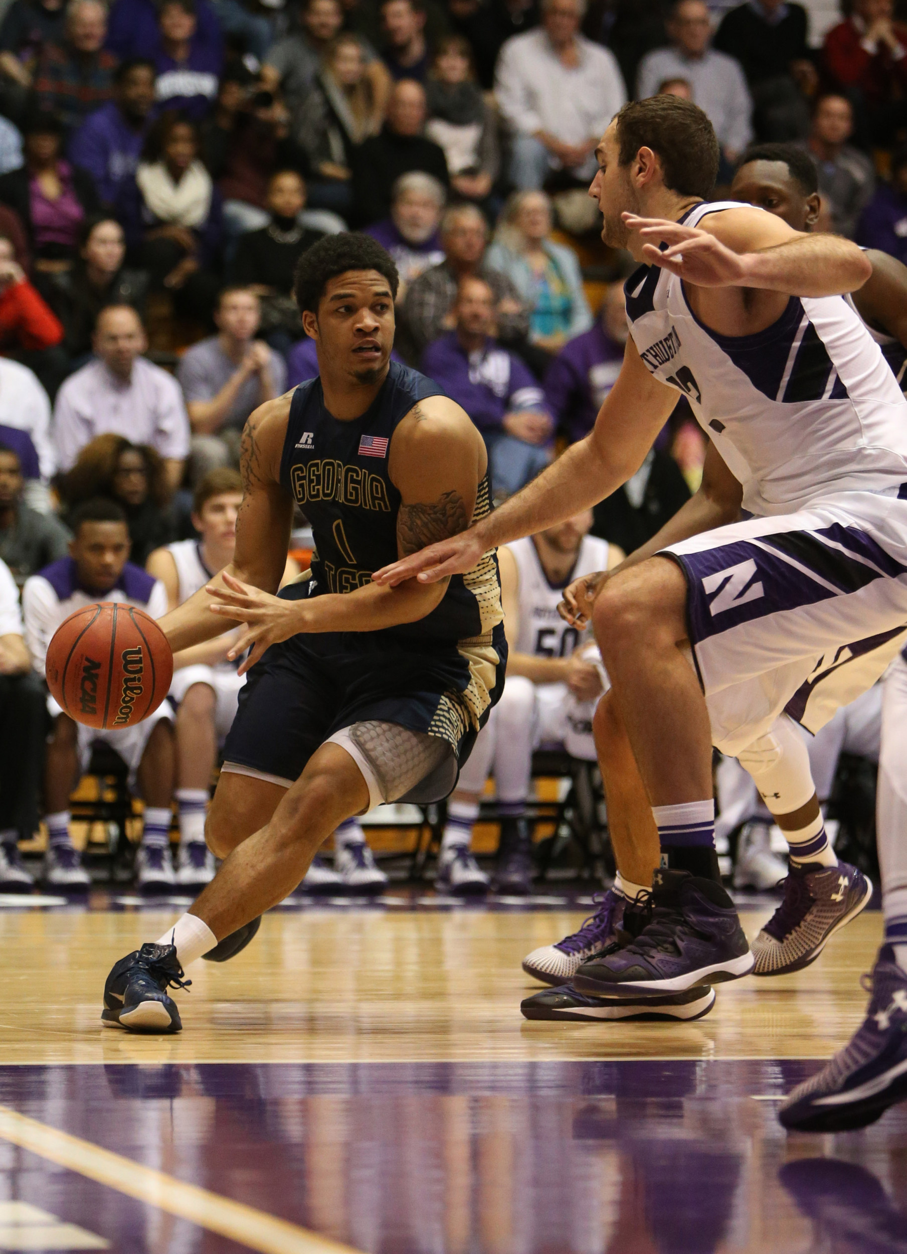 Georgia Tech Yellow Jackets guard Tadric Jackson (1) dribbles around Northwestern Wildcats center Alex Olah (22) at Welsh-Ryan Arena. Mandatory Credit: Caylor Arnold-USA TODAY Sports