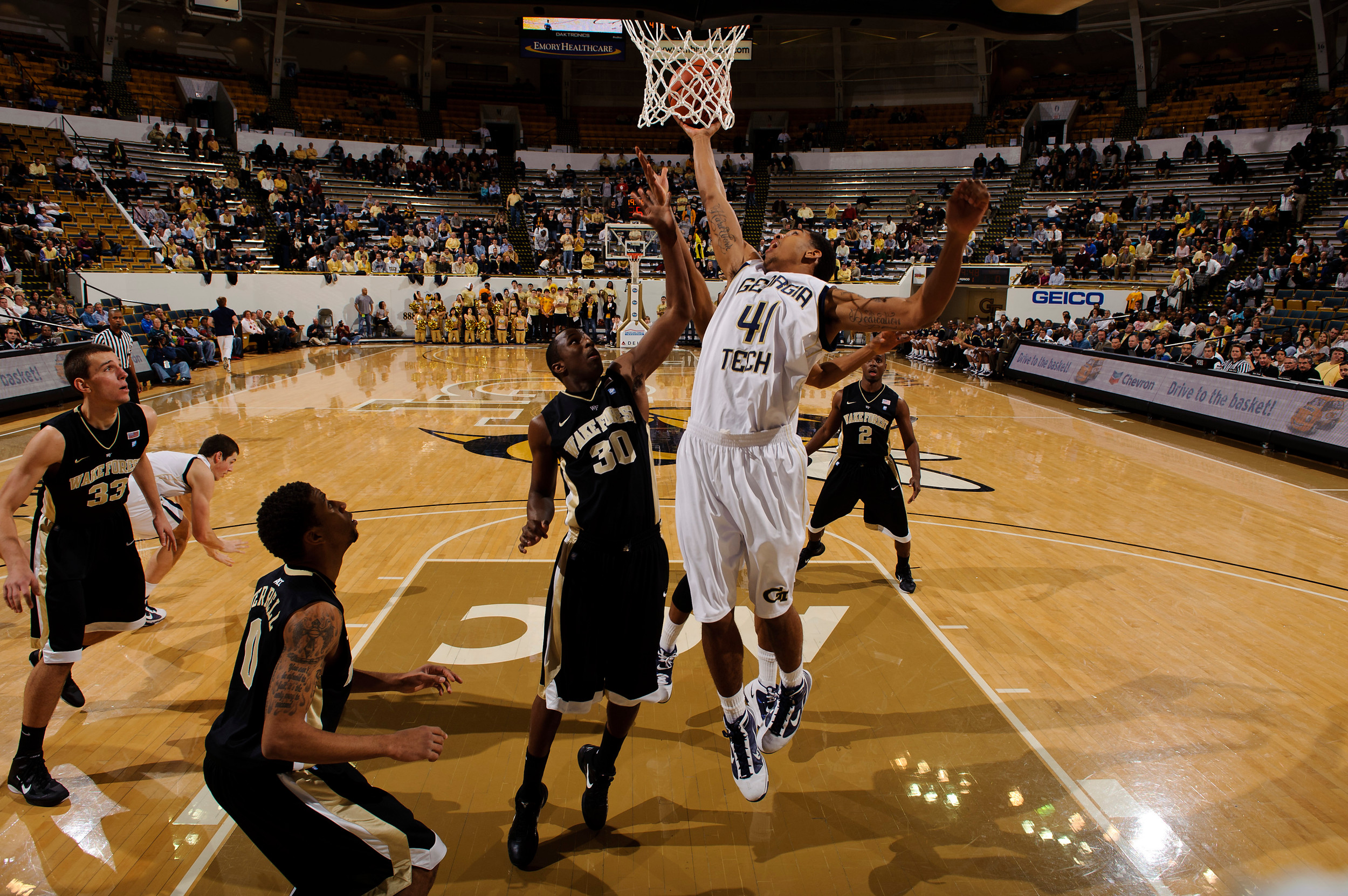 Jan 19, 2011; Atlanta, GA, USA; Georgia Tech Yellow Jackets guard Glen Rice Jr. (41) works against Wake Forest Demon Deacons forward Travis McKie (30) at the basket during the first half at Alexander Memorial Coliseum. Georgia Tech defeated Wake Forest 74-39. Mandatory Credit: Paul Abell-US PRESSWIRE