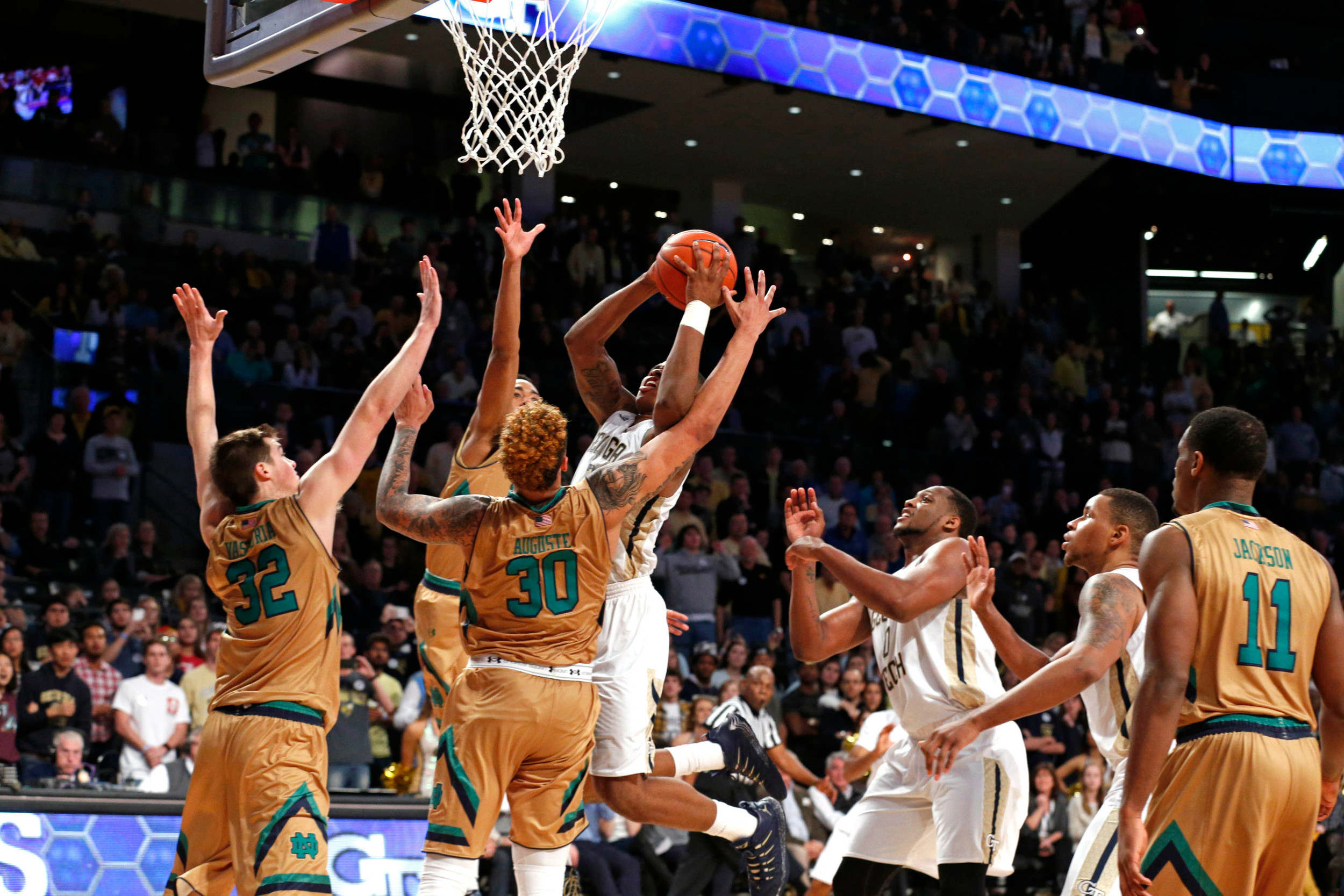 Yellow Jackets guard Marcus Georges-Hunt scores the game-winning basket in front of Notre Dame Fighting Irish guard Steve Vasturia and forwards Bonzie Colson and Zach Auguste in the second half at McCamish Pavilion. Credit: Jason Getz-USA TODAY Sports
