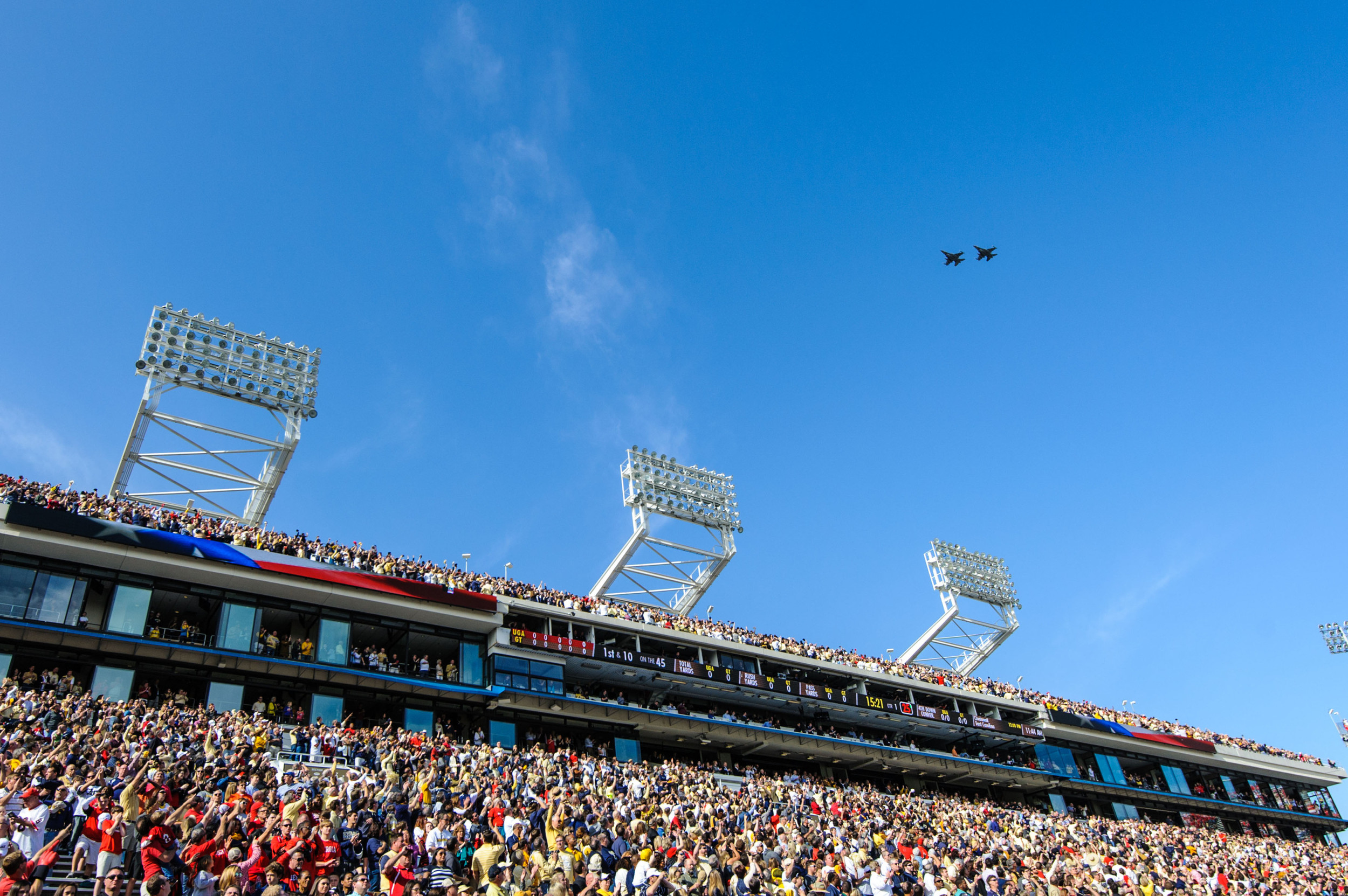 A pair of F-16 Fighting Falcons fly over Bobby Dodd Stadium